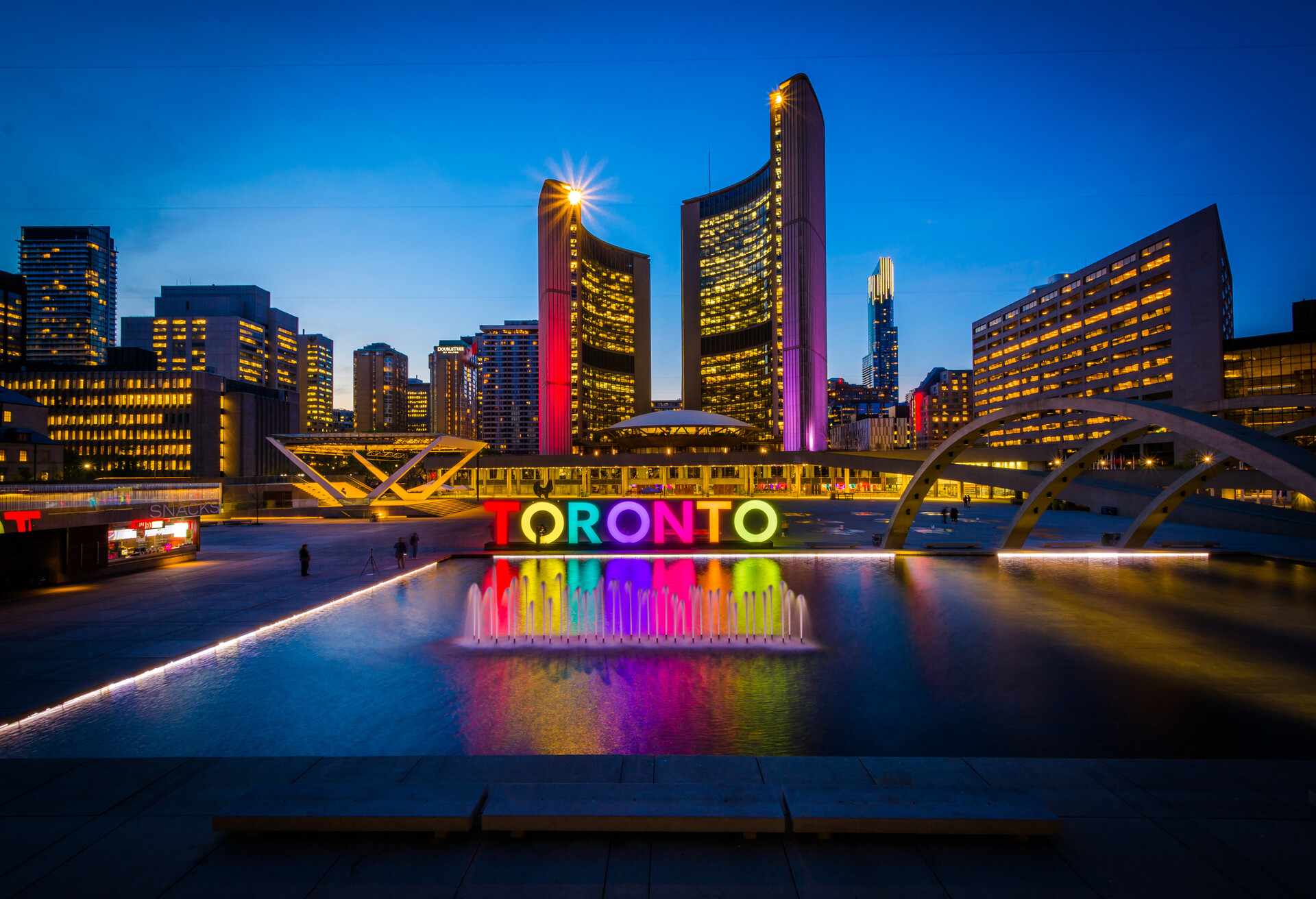 View of Nathan Phillips Square and Toronto Sign in downtown at night, in Toronto, Ontario.; Shutterstock ID 418975963