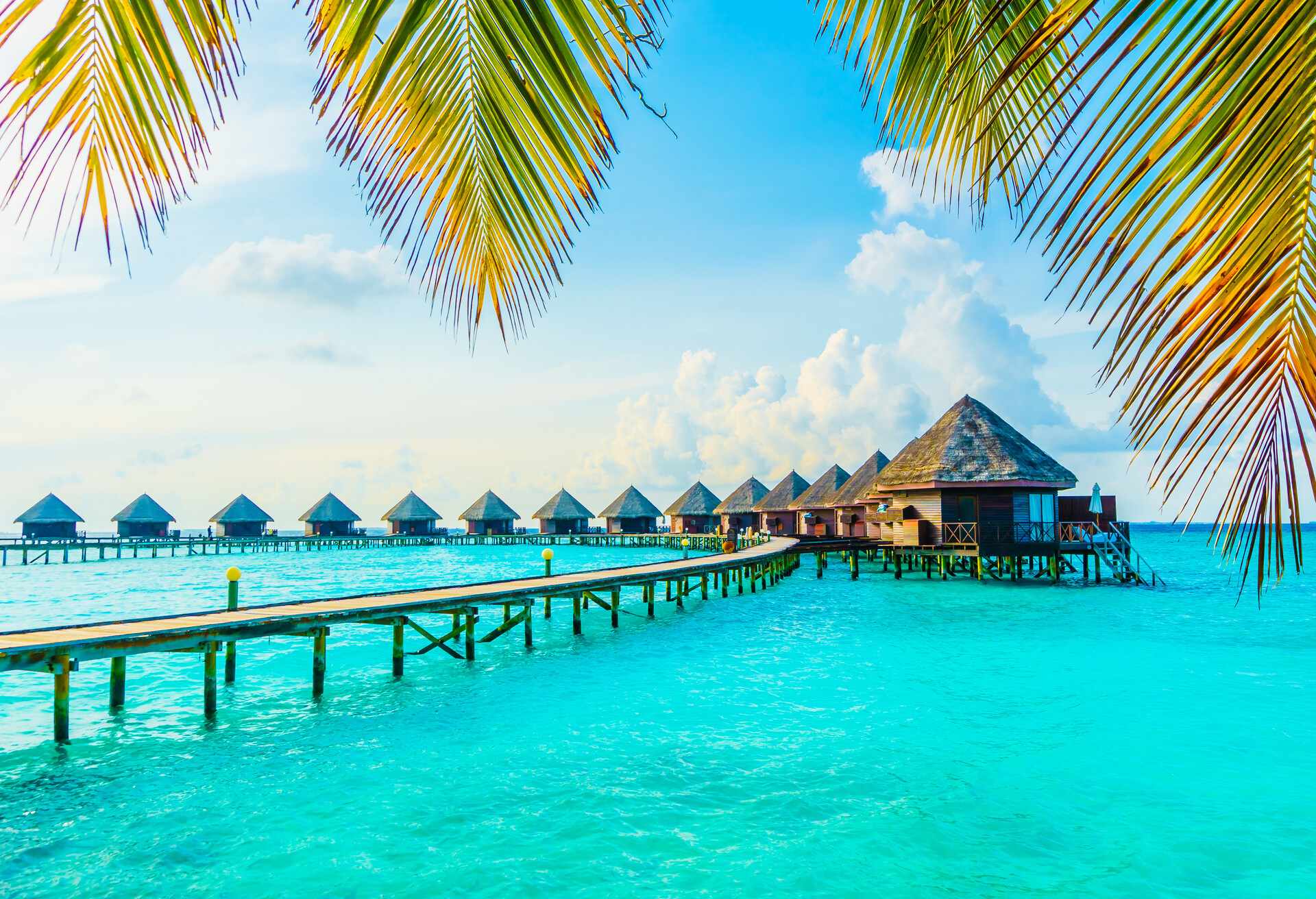 Beautiful tropical Maldives resort hotel and island with beach and sea on sky for holiday vacation background concept -Boost up color Processing; Shutterstock ID 427956421