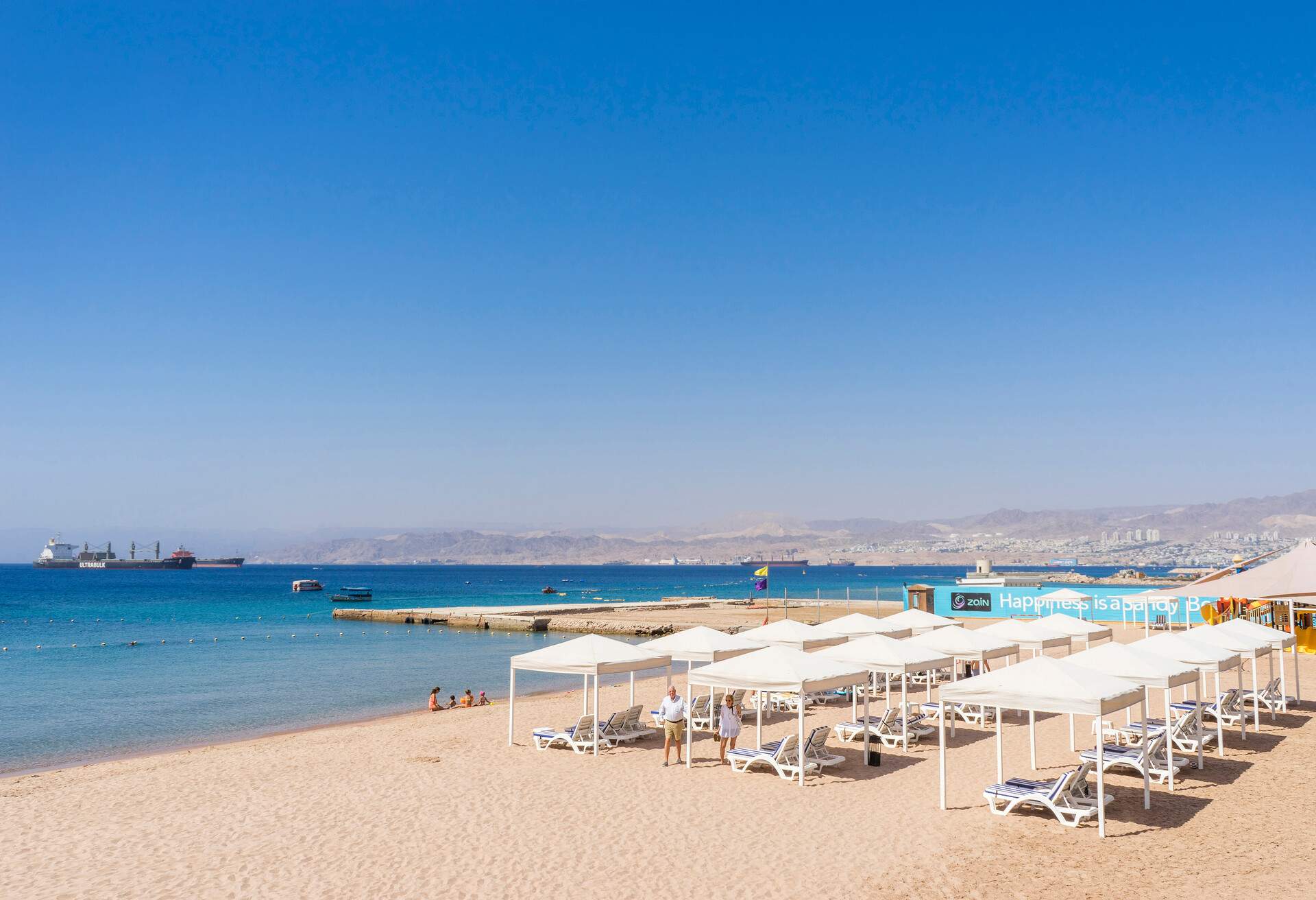 View of beach with cabanas of Gulf of Aqaba, Aqaba, Jordan