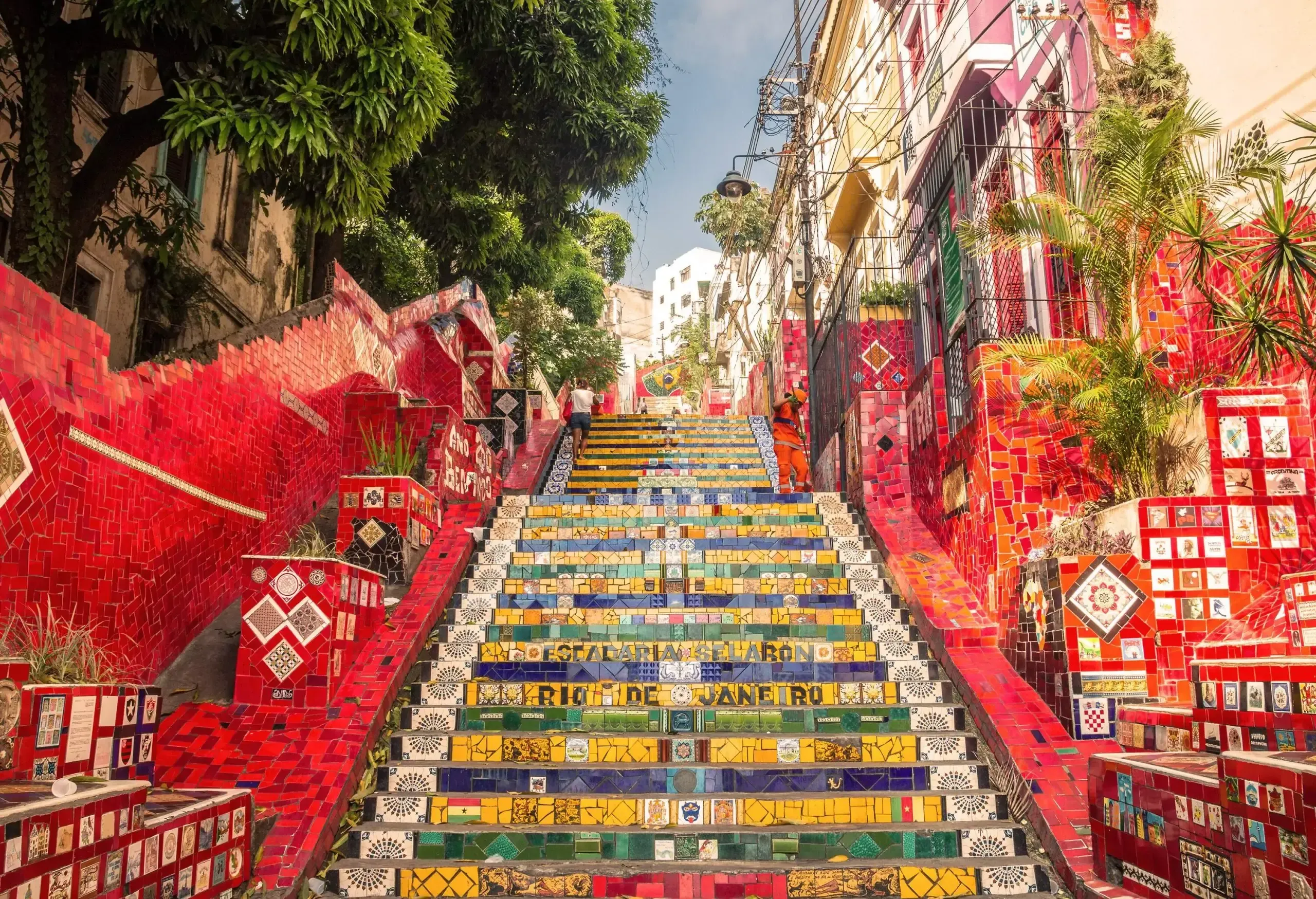 Low angle view of colourful tiled steps and red tiled wall in a Latin American city on a sunny day