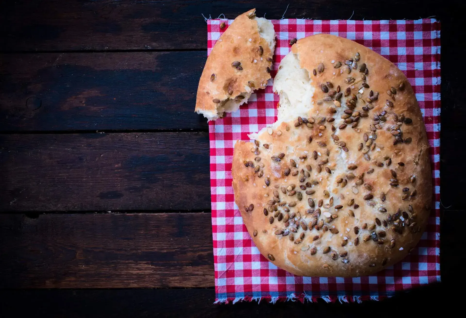 Bannock on a red and white checkered serviette on a wooden table