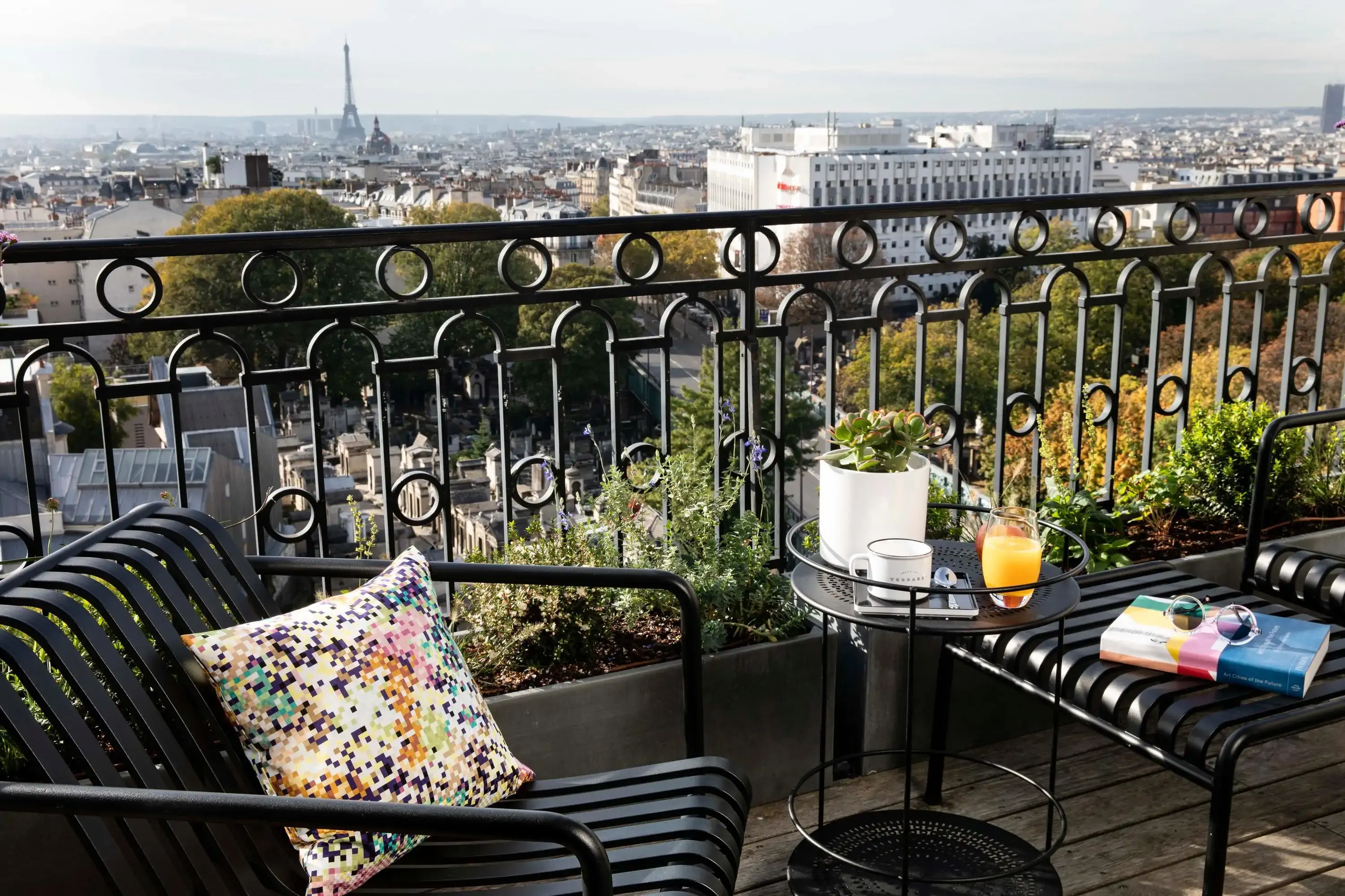 Rooftop terrace overlooking Paris with Eiffel Tower in the background