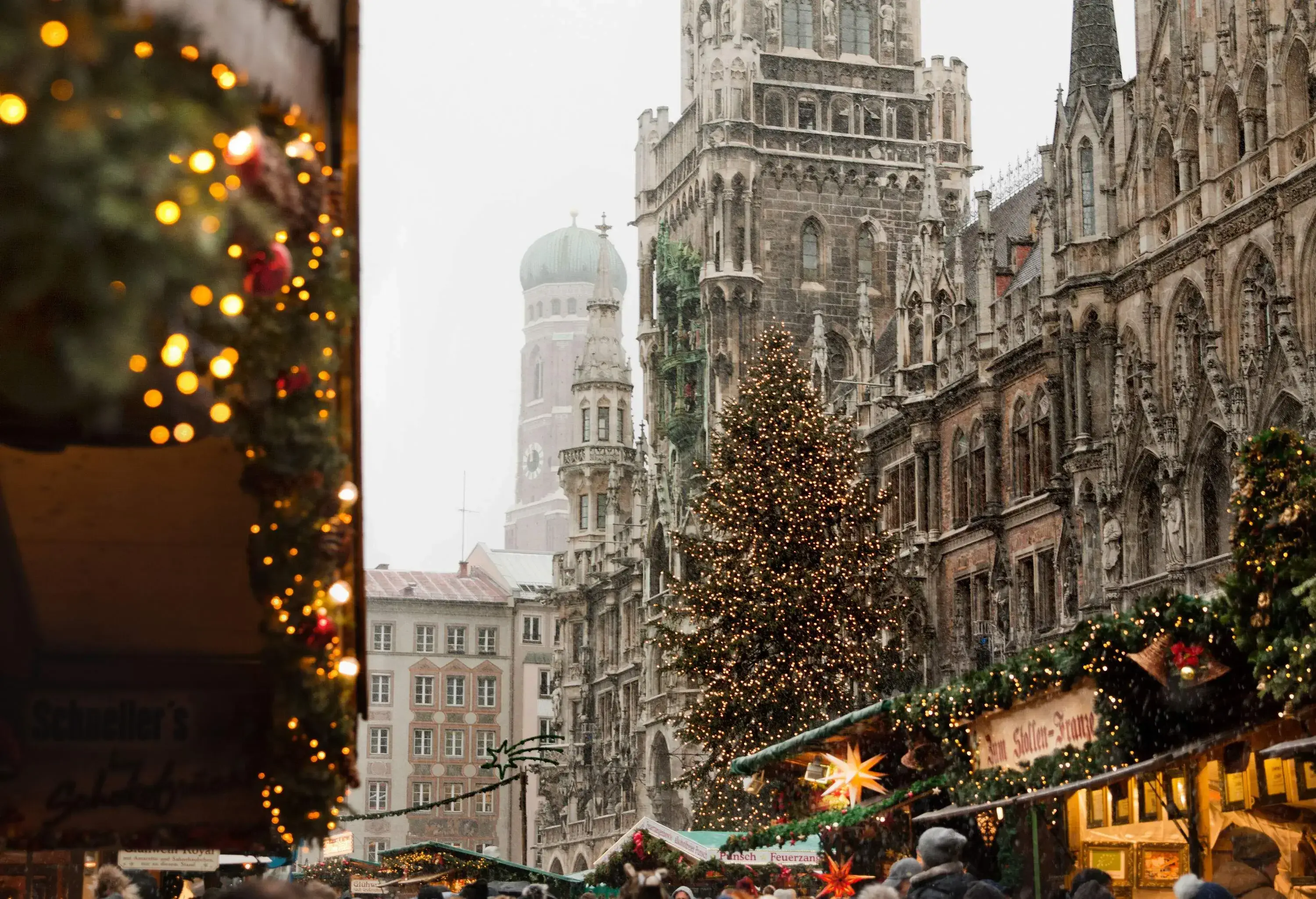 Facade of Munich's New Town Hall with neo-gothic architecture in front of the Christmas Market.