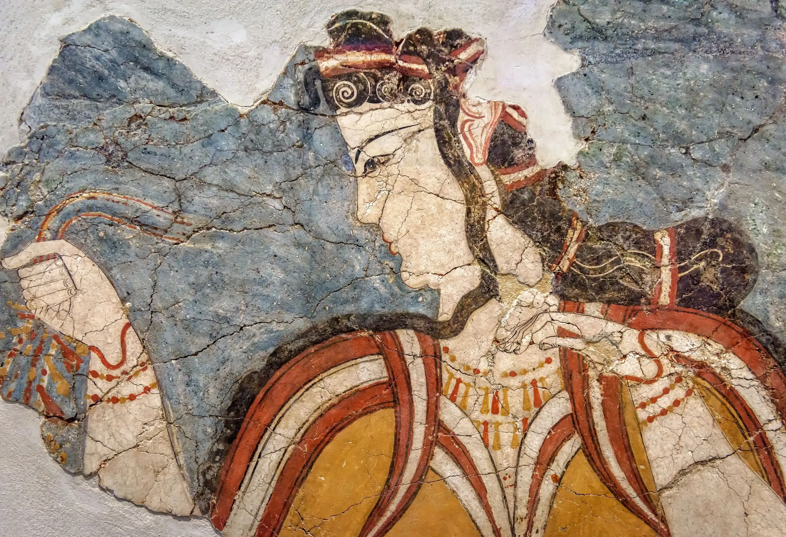 An antique mural painting of a Greek woman on plastered walls.