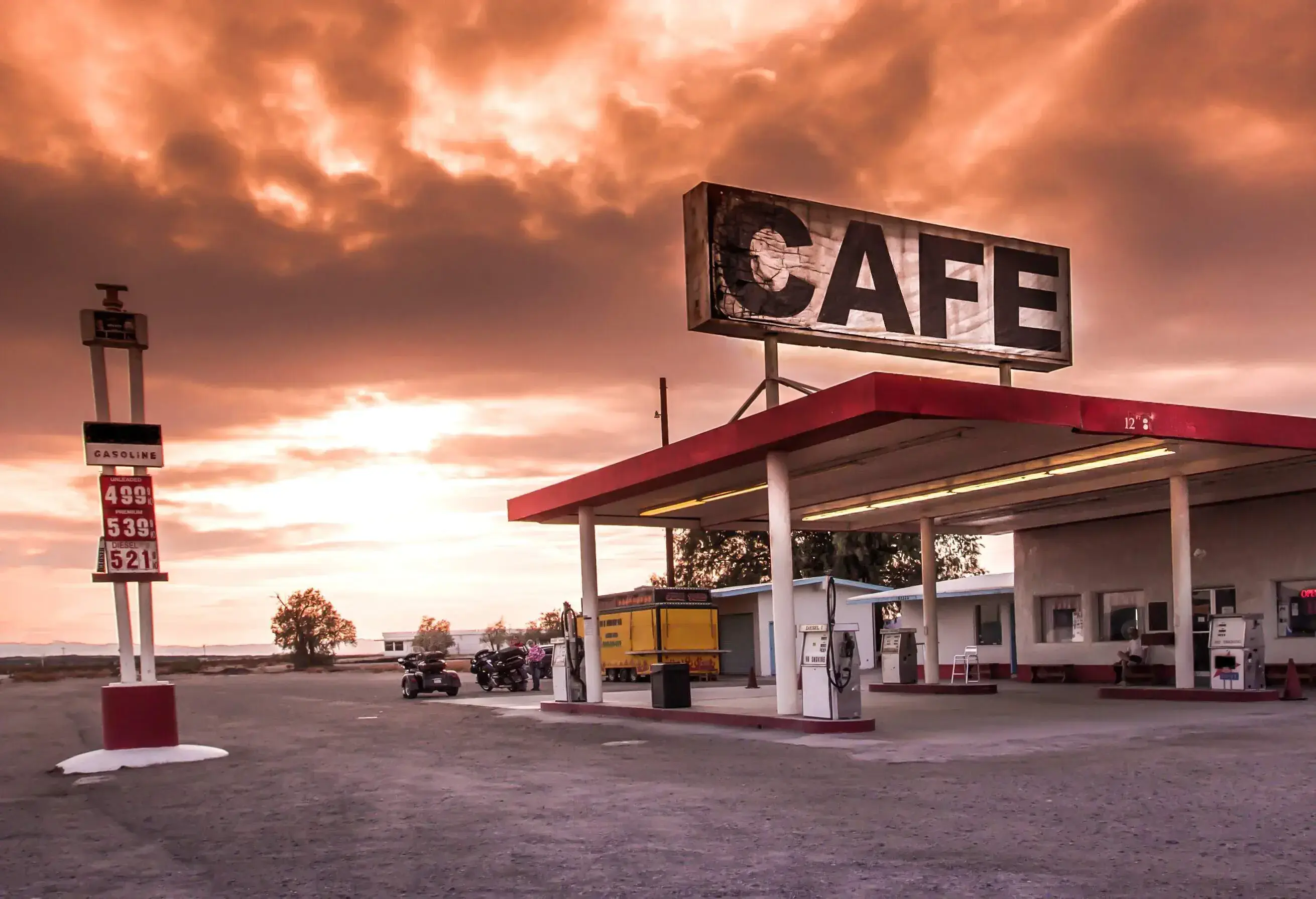 A photo of an American gas station with a Cafe sign at the top.