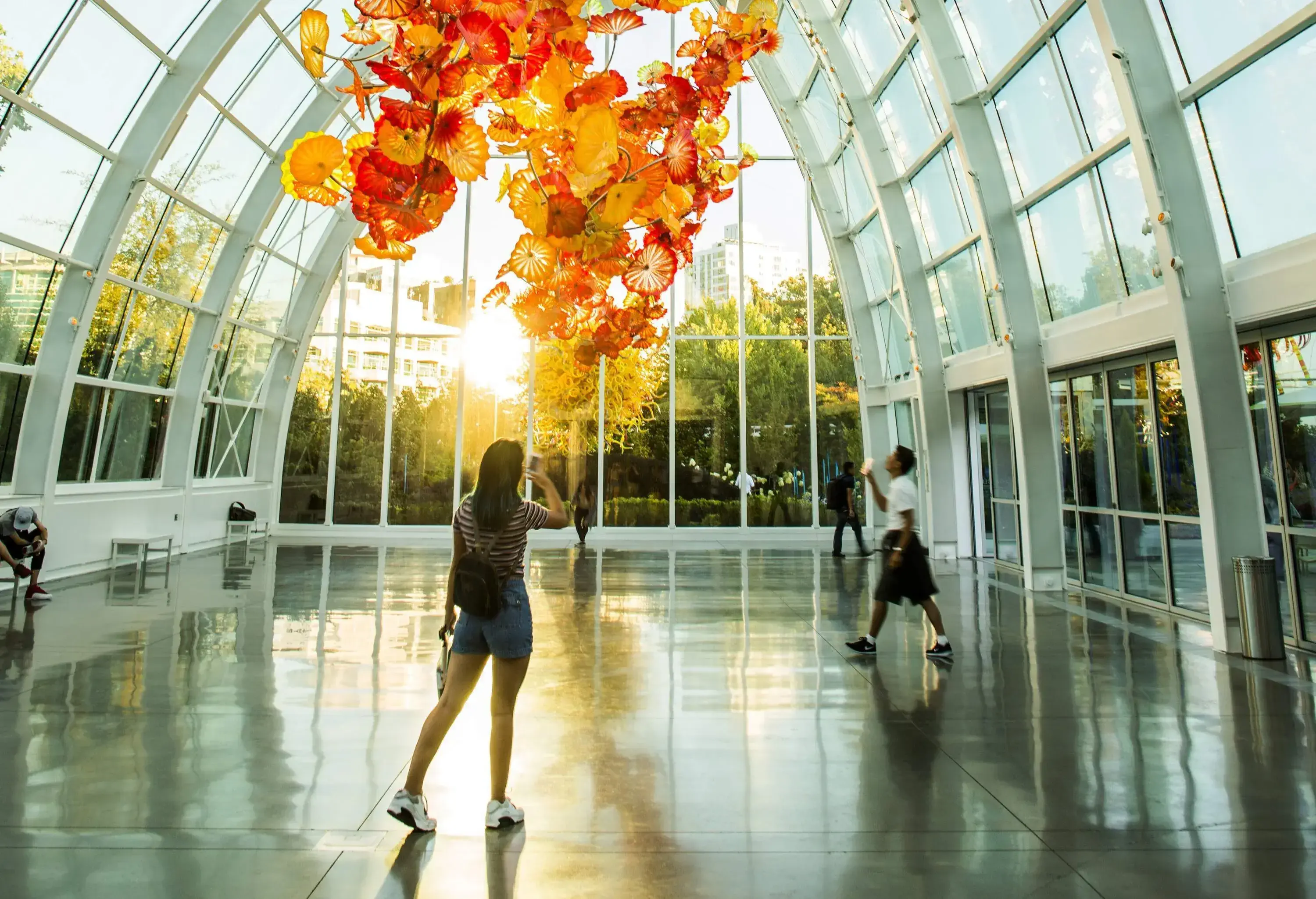 Two people in a glass dome photographic floral sculpture