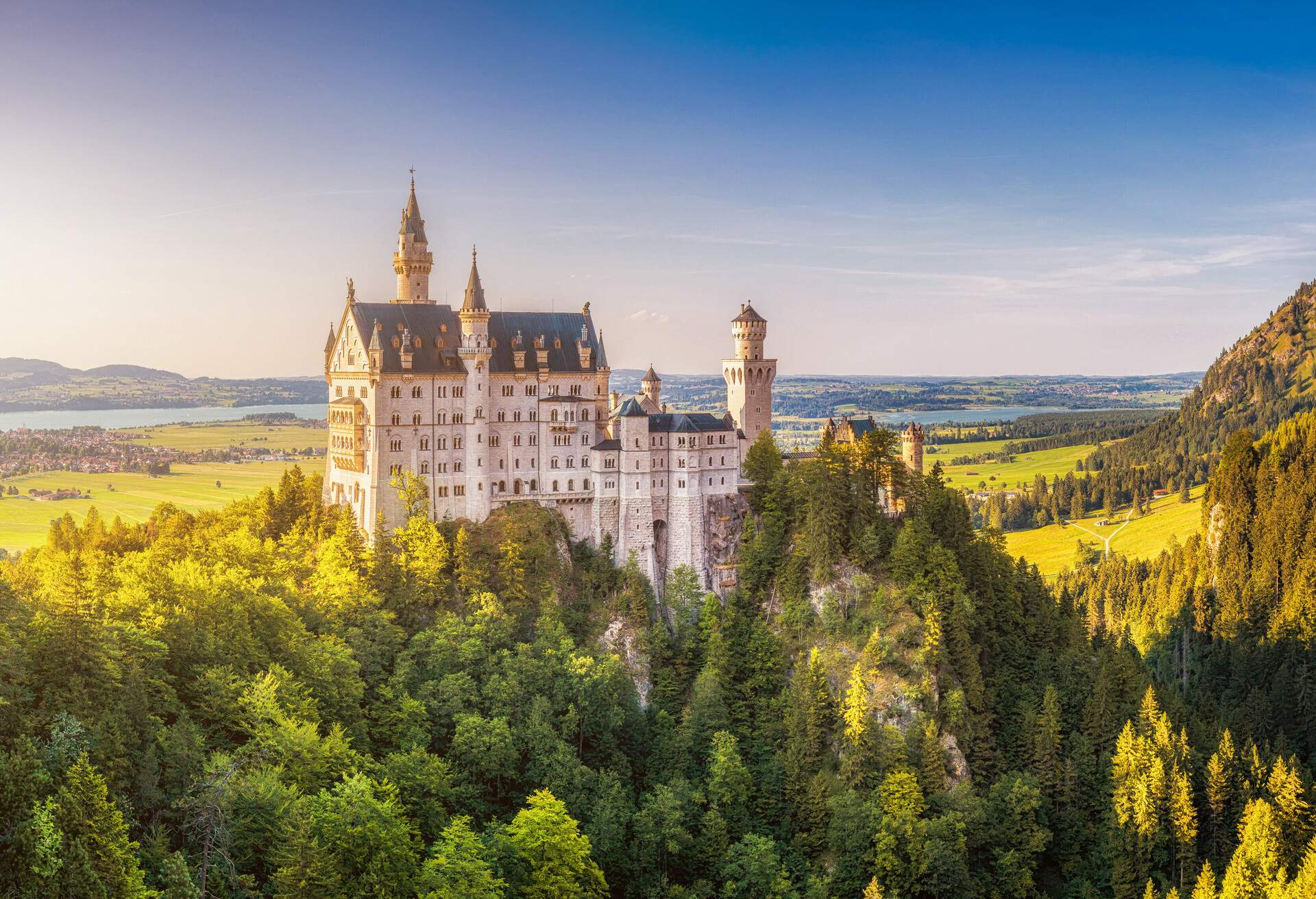 Beautiful view of world-famous Neuschwanstein Castle, the 19th century Romanesque Revival palace built for King Ludwig II, in beautiful evening light at sunset, Fussen, southwest Bavaria, Germany; Shutterstock ID 428991871; Purpose: Newsletter; Brand (KAYAK, Momondo, Any): Any
