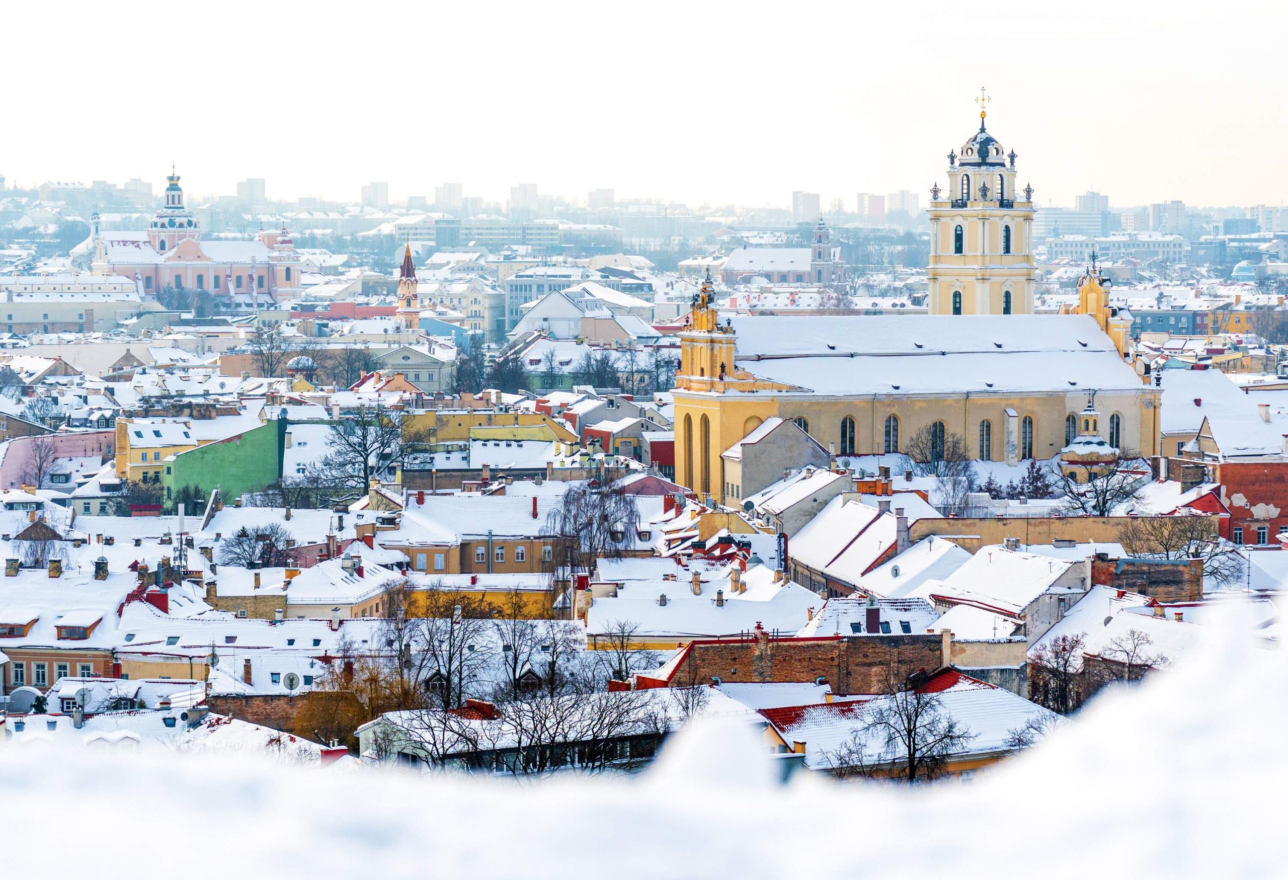 Aerial view of Vilnius old town, capital of Lithuania in winter day with roof covered by the snow