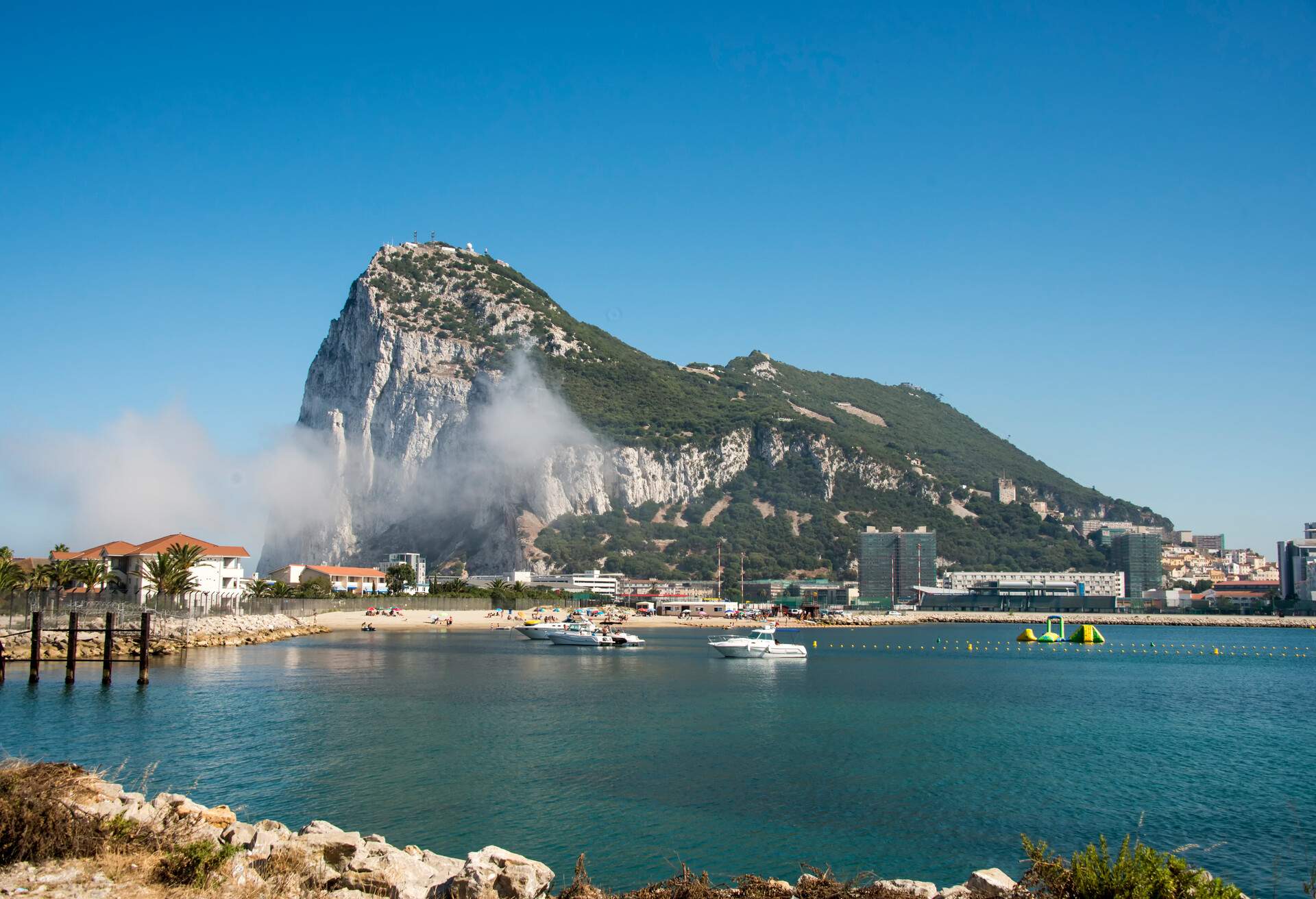View of the Rock of Gibraltar and Mediterranean Sea , which is a British Overseas Territory, located on the southern end of the Iberian Peninsula