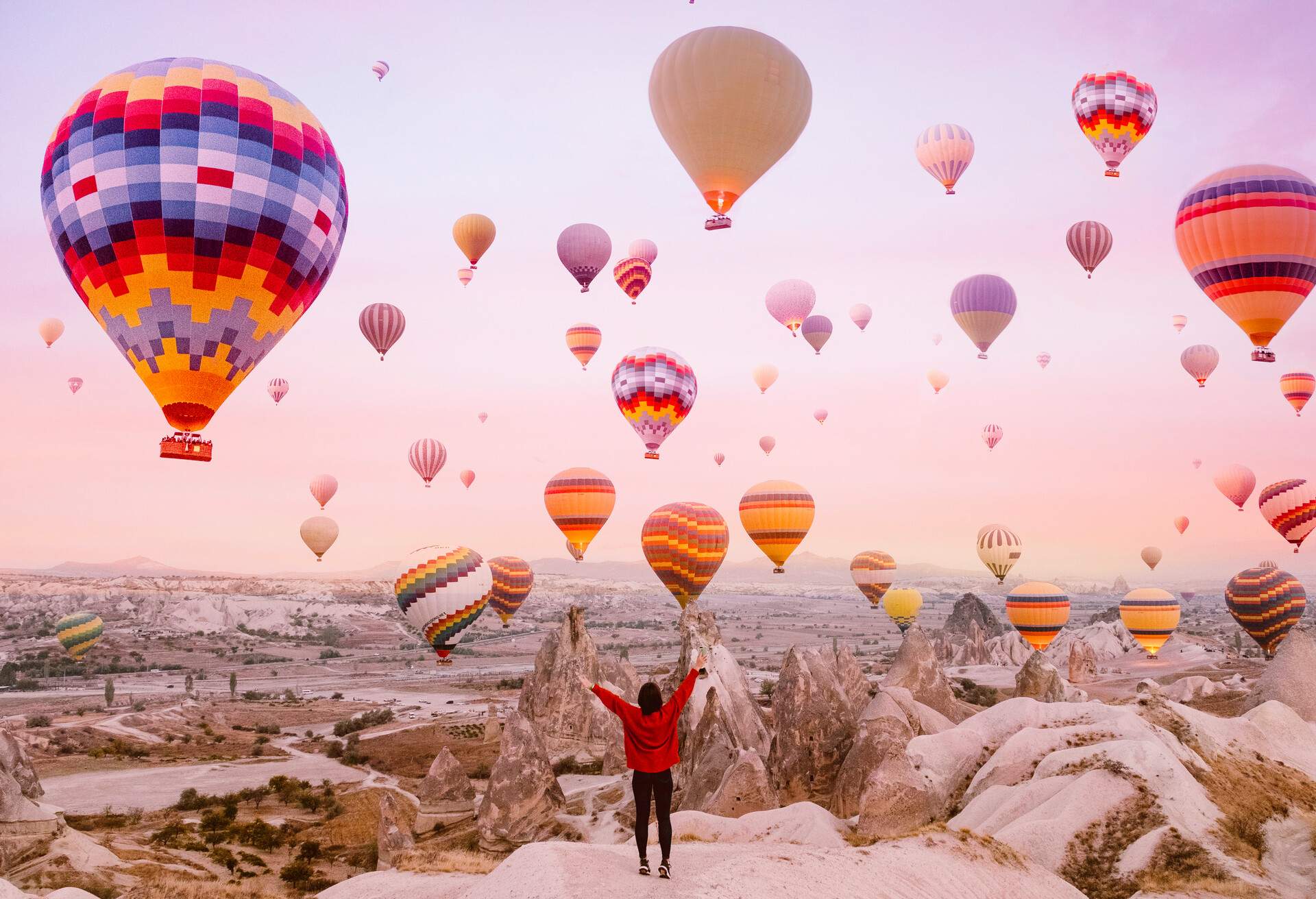 CAPPADOCIA WOMAN WITH FLYING BALLOONS IN FRONT