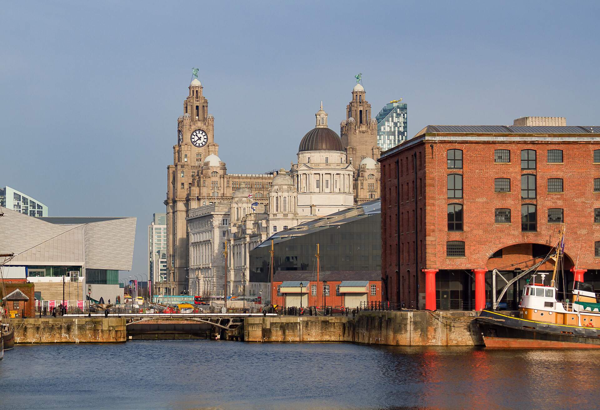 A cityscape view of Liverpool, uk, taken from the Albert dock and showing the maritime and Liver buildings in the distance