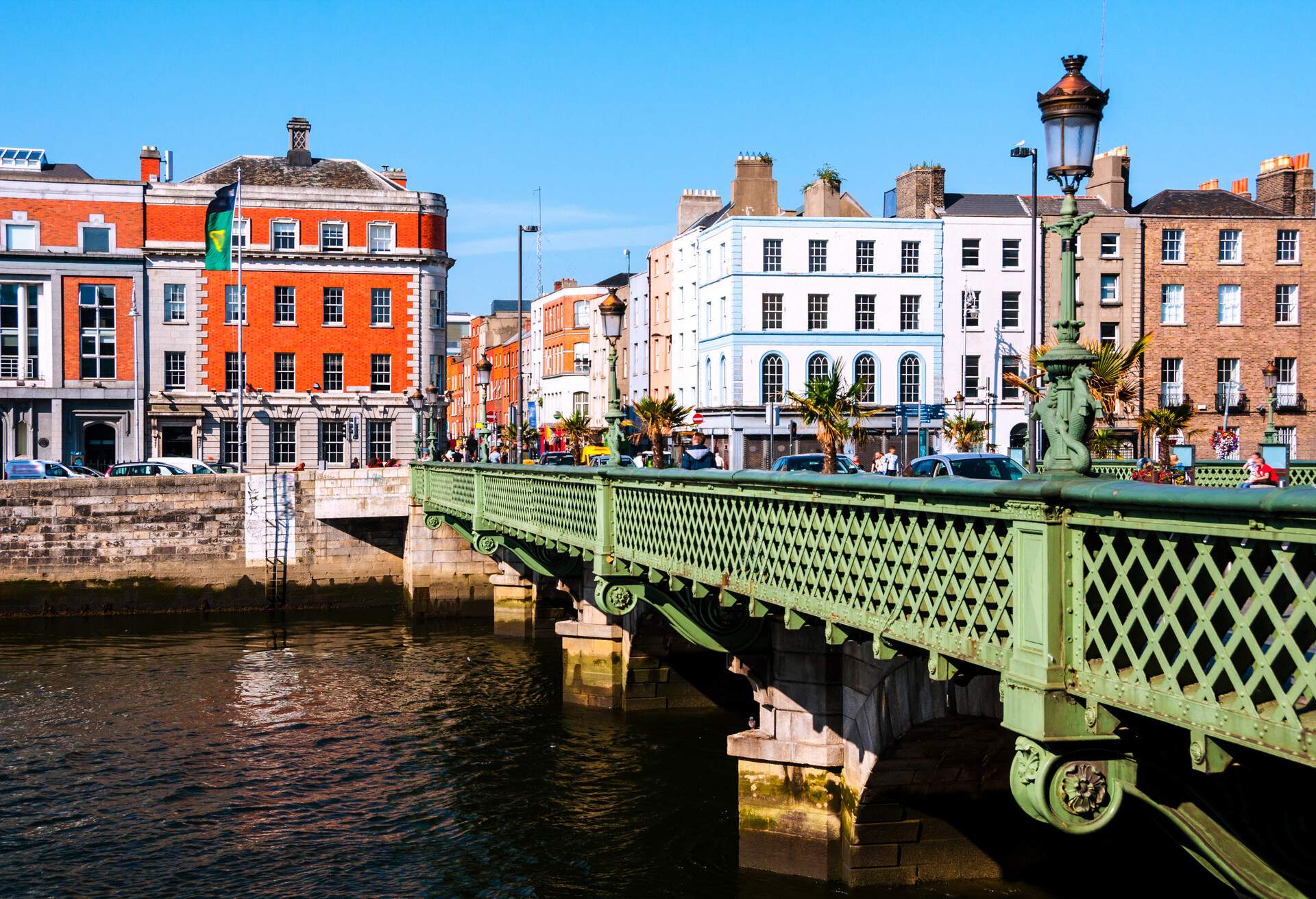 A road bridge across from colourful buildings along the intersection.