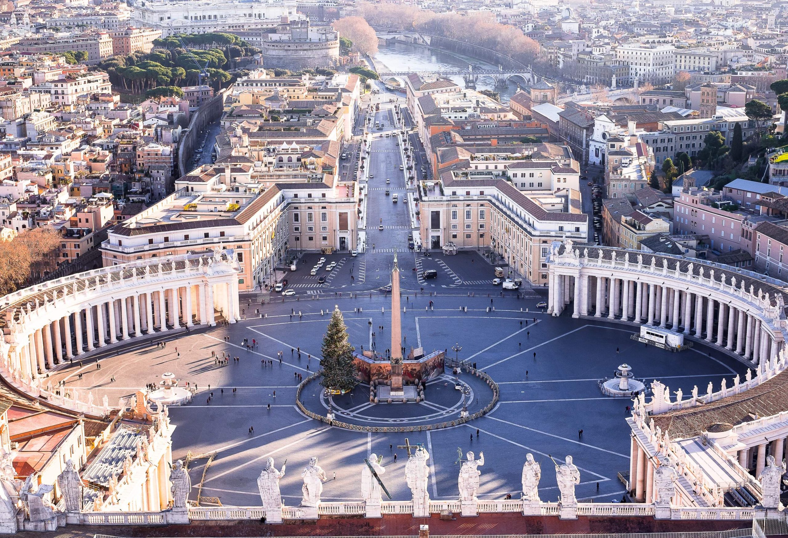 Aerial view of the Vatican city shows Saint Peter's Square with an ancient Egyptian obelisk next to a tall Christmas tree in the centre.
