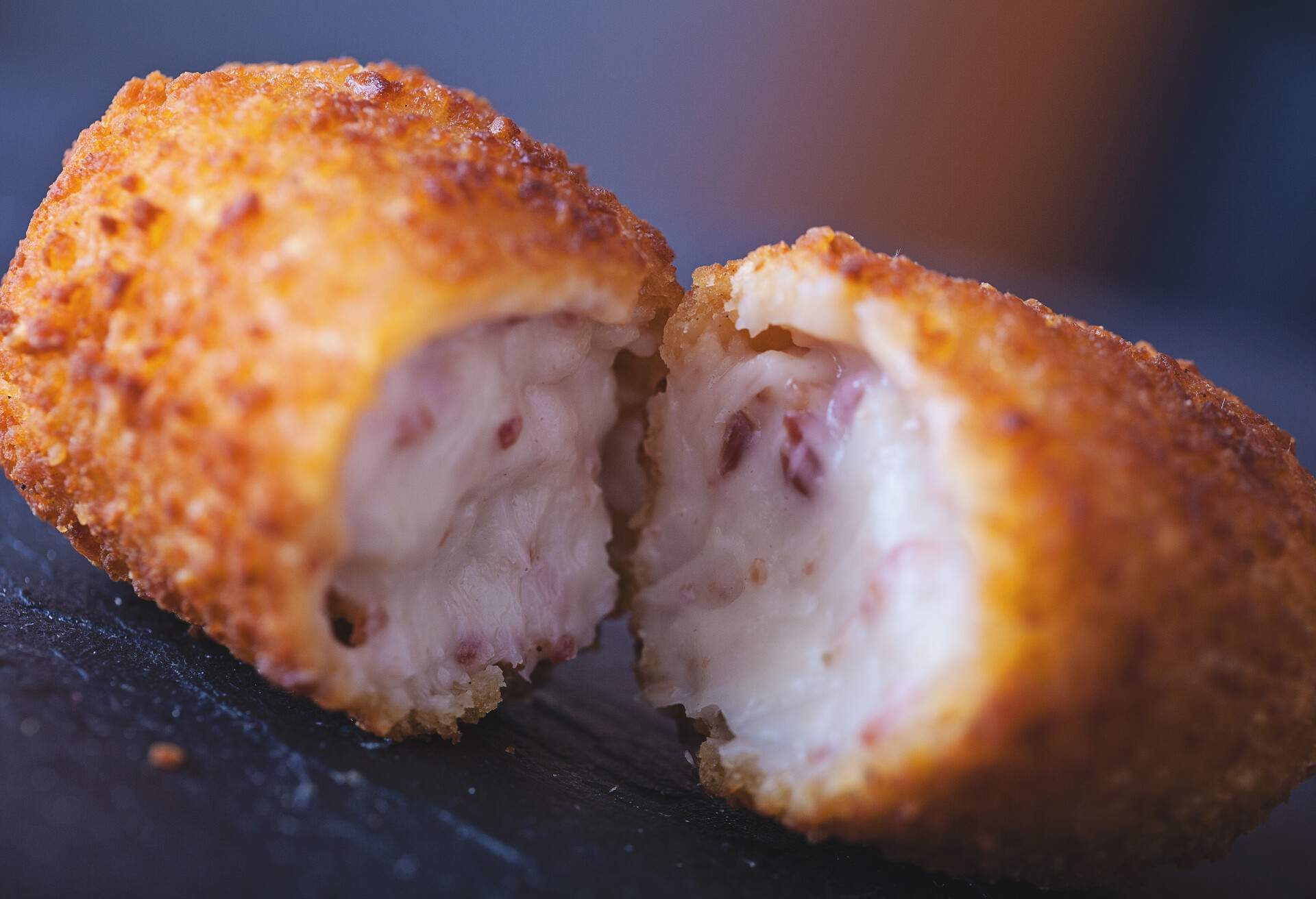 Close up of a croqueta, made with bechamel and serrano ham