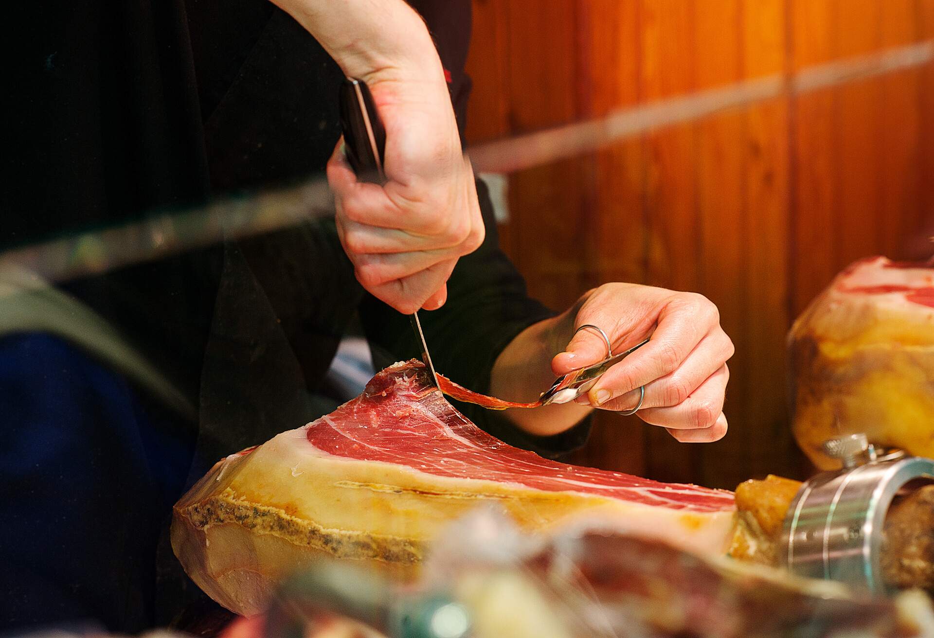 Jamón being cut in thin slices ready to eat by a Caucasian man Valencia Spain