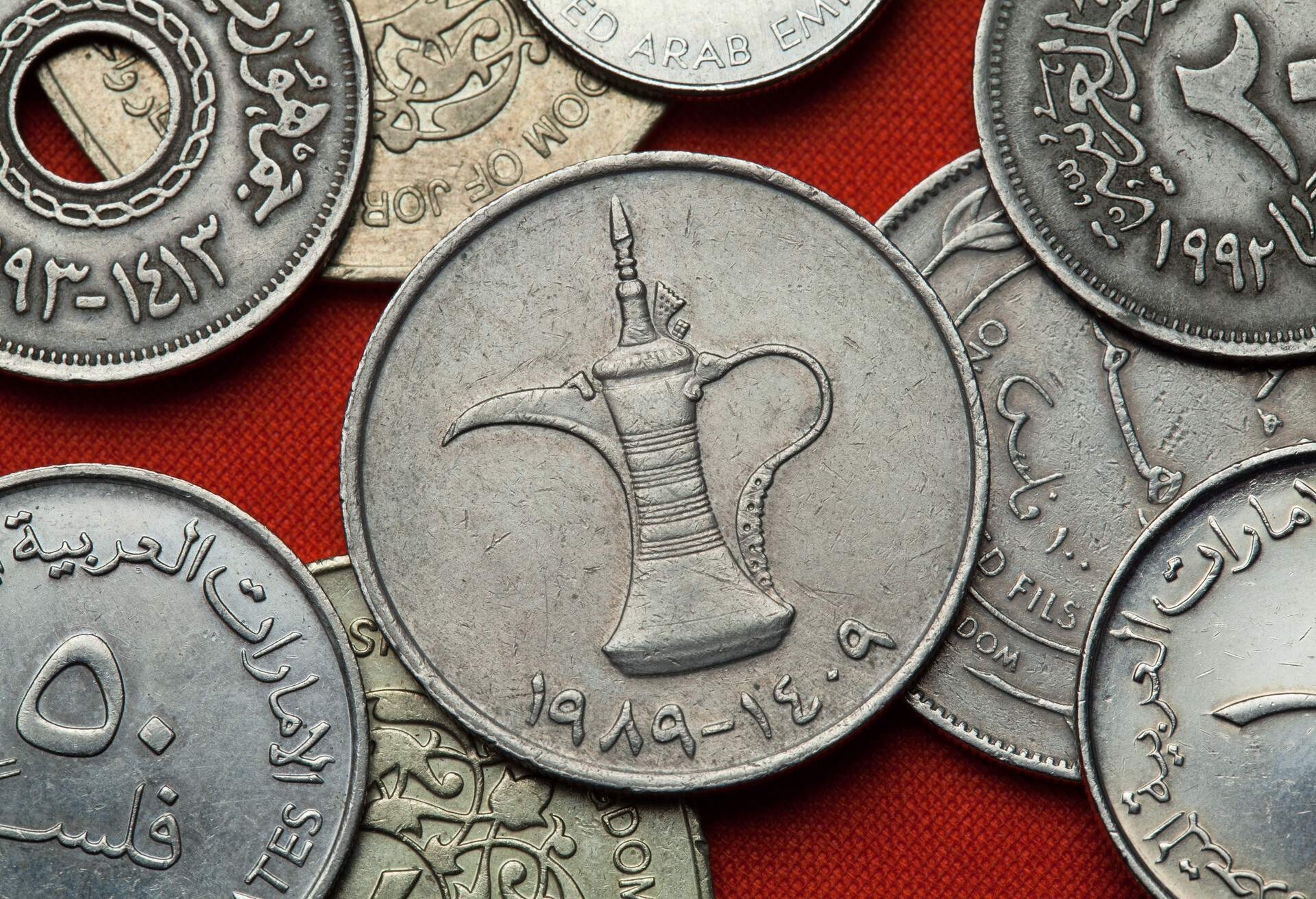 Coins of the United Arab Emirates. Arab tea pot depicted in the UAE one dirham coin.