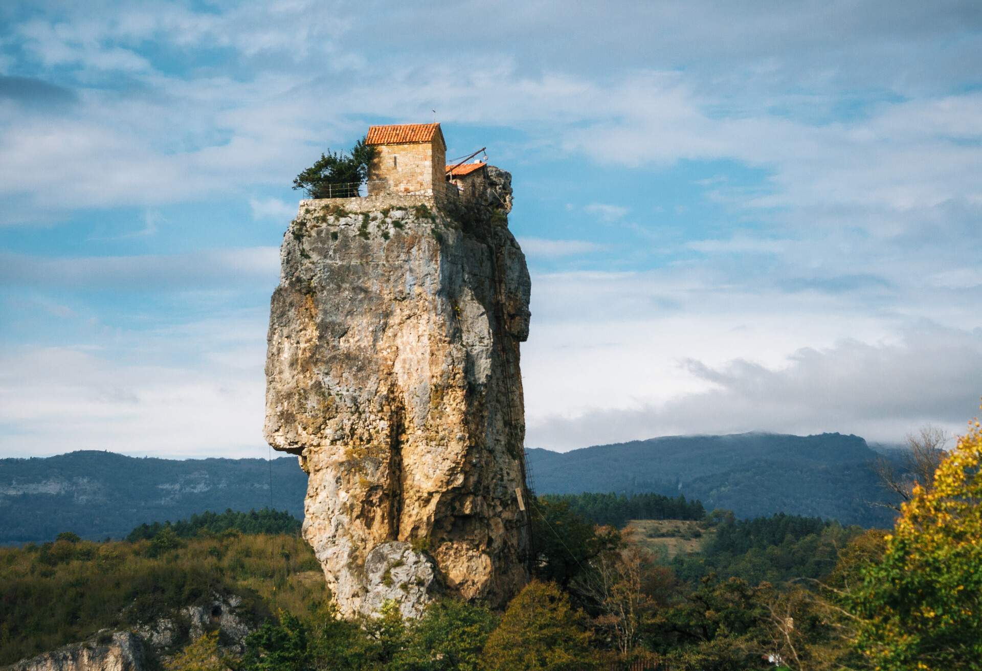 Katskhi pillar. Georgian landmarks. Man's monastery near the village of Katskhi. The orthodox church and the abbot cell on a rocky cliff. Imereti, Georgia. Georgian Meteora