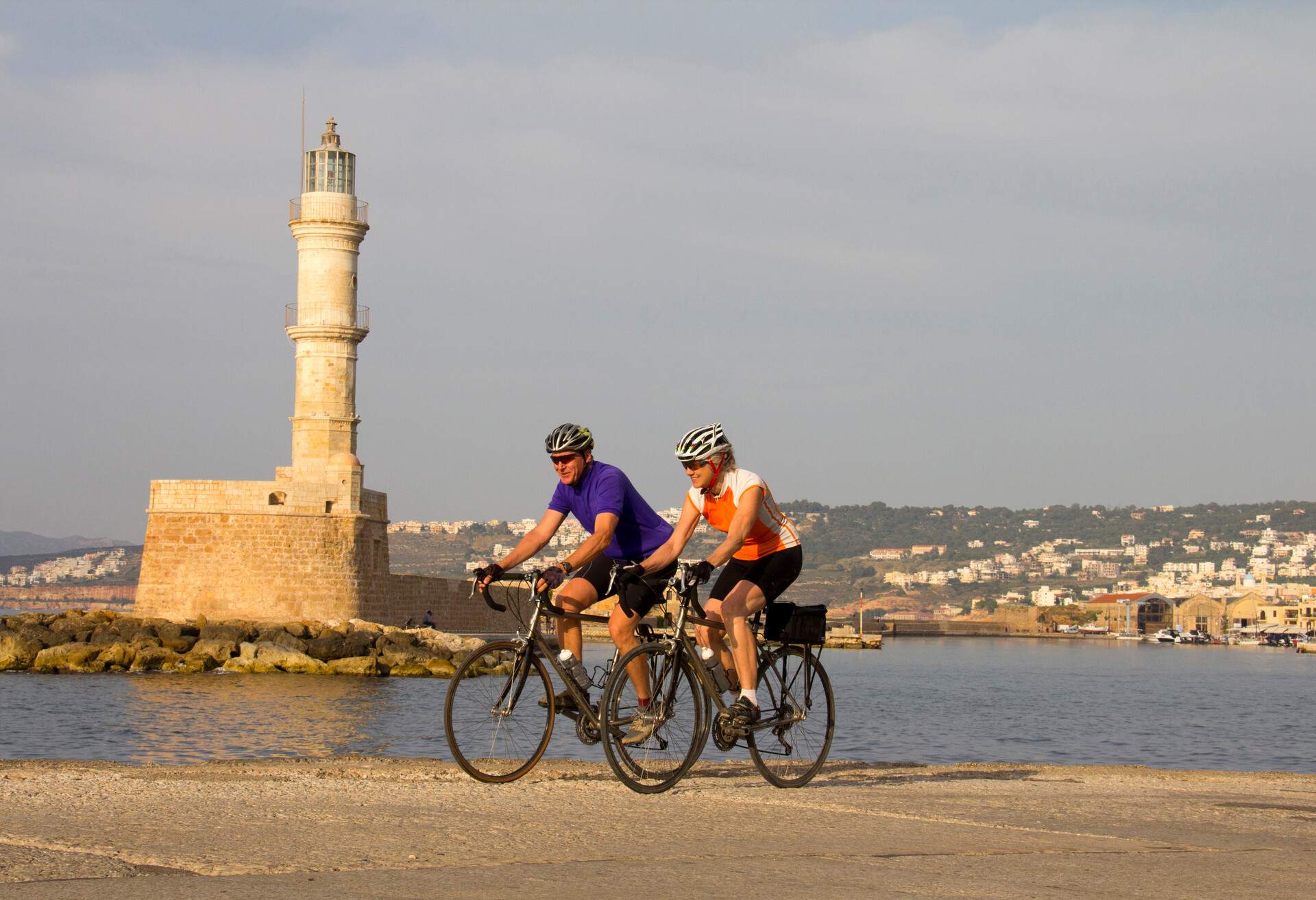 DEST_GREECE_CRETE_CHANIA_THEME_COUPLE_CYCLING_GettyImages-130251314