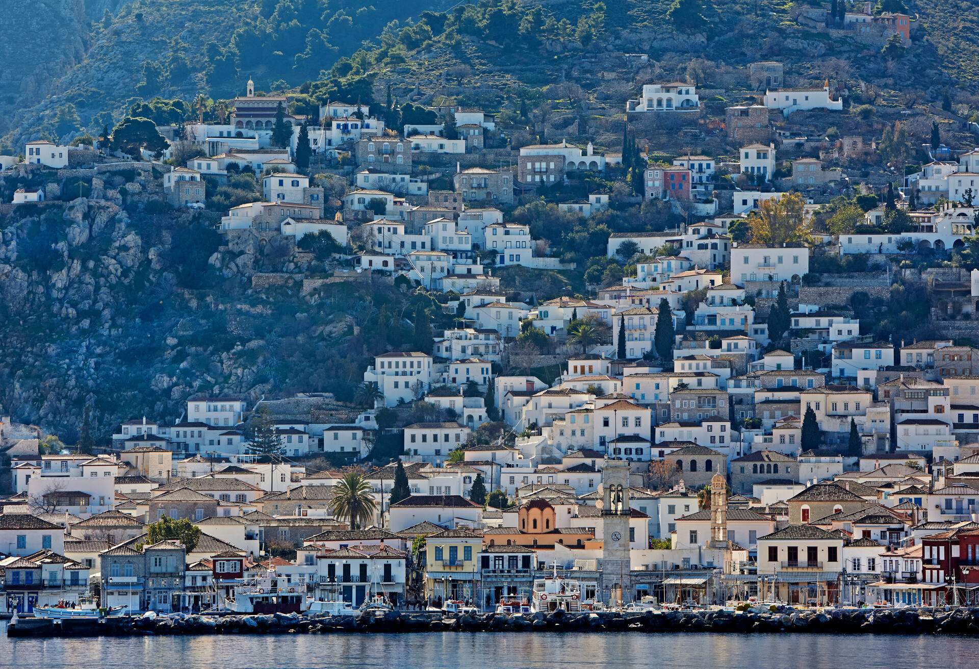 View of traditional Greek houses in the port of Hydra Town on the isle of Hydra, one of the Saronic islands of Greece.