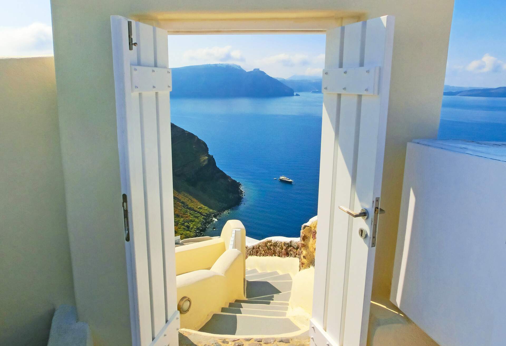 View to the sea from stairs in Oia the most beautiful village of Santorini island in Greece