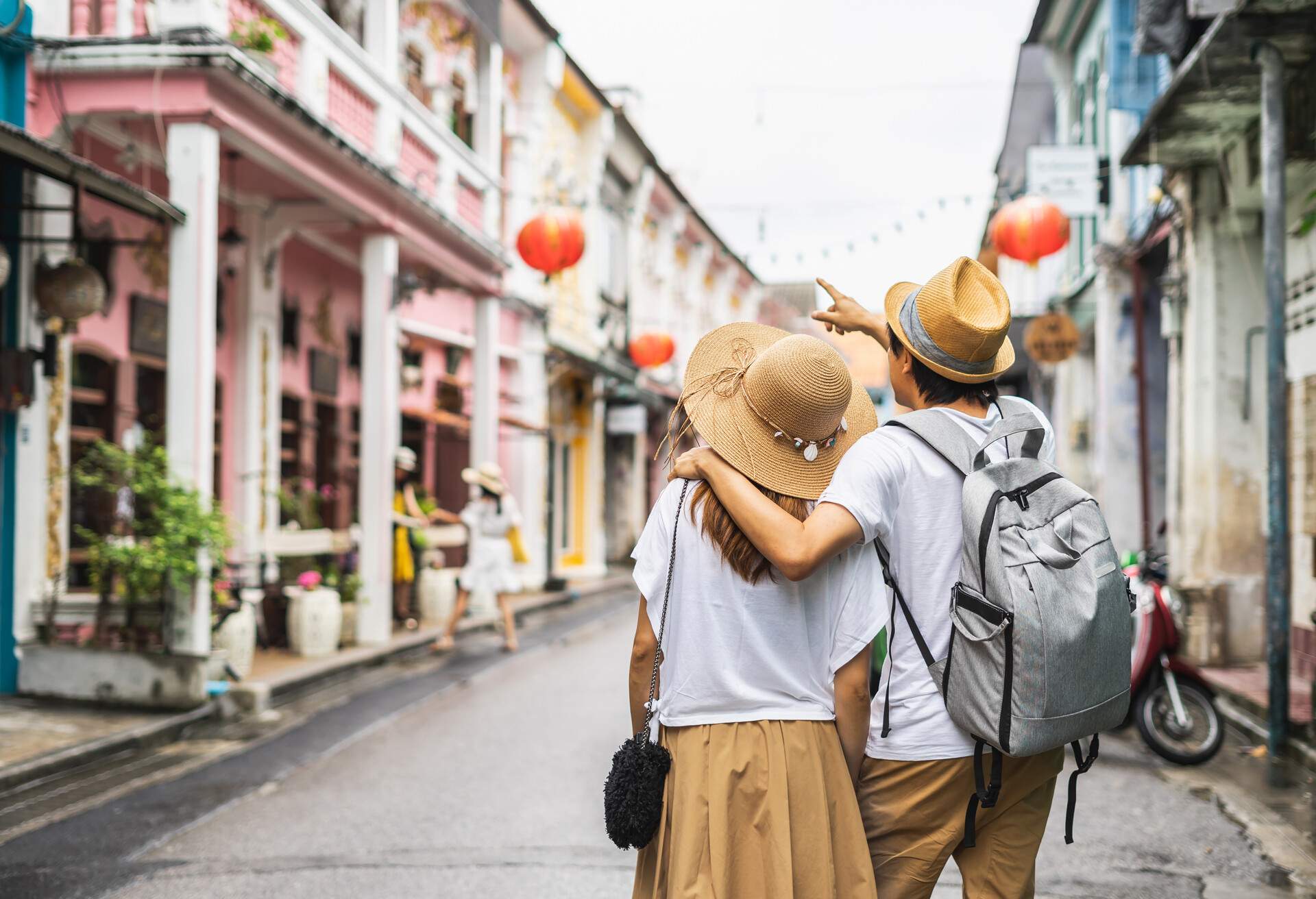 DEST_THAILAND_PHUKET-CITY_Young couple traveler walking at Phuket old town_GettyImages-1005222214