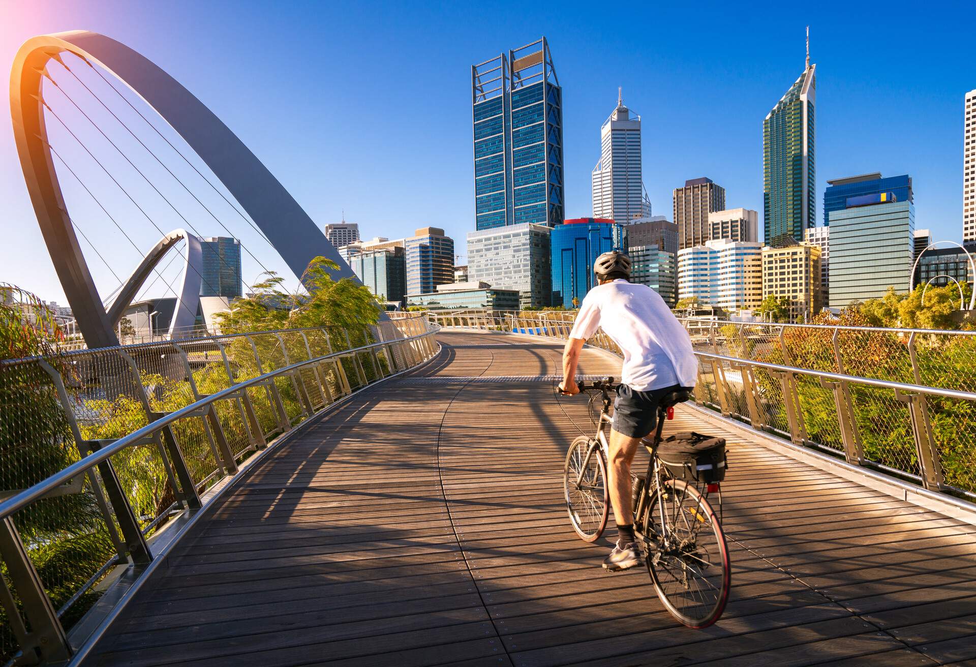A man cycling on an elizabeth bridge in Perth city, western, Australia, this image can use for bike, sport, relax, healthy concept