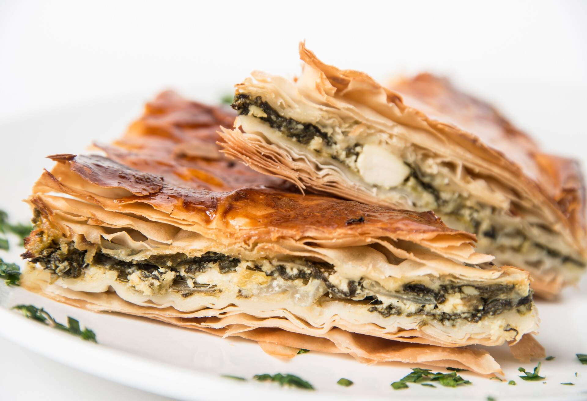 Spanakopita is a Greek pastry filled with spinach and cheese
