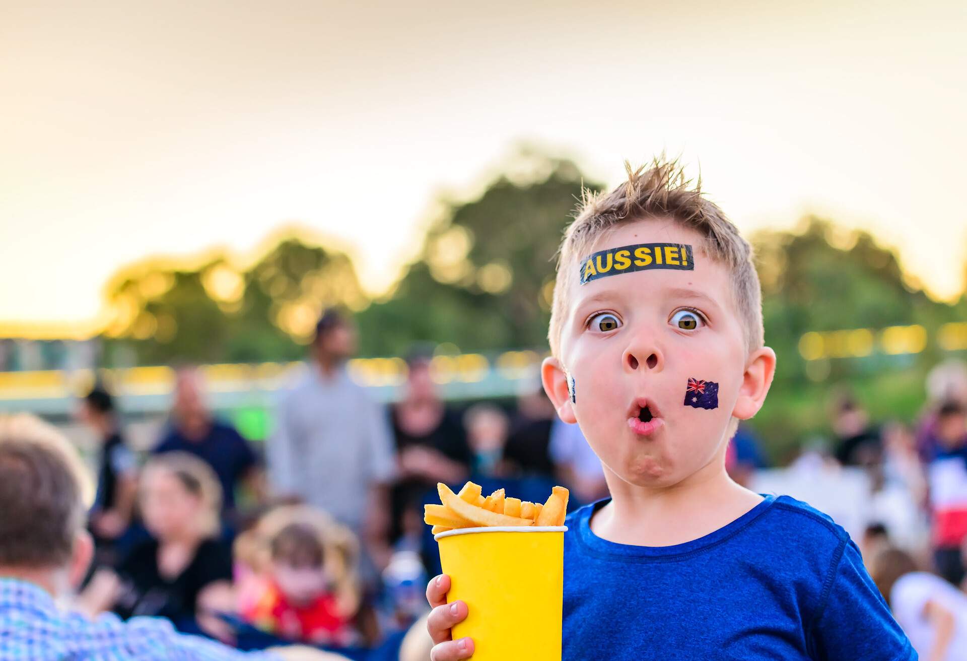 Cute Australian boy with flag tattoo on his face on Australia Day celebration in Adelaide