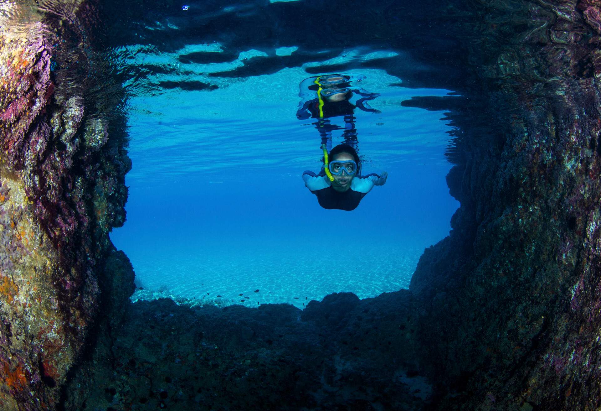 Freediver into a undersea cave.