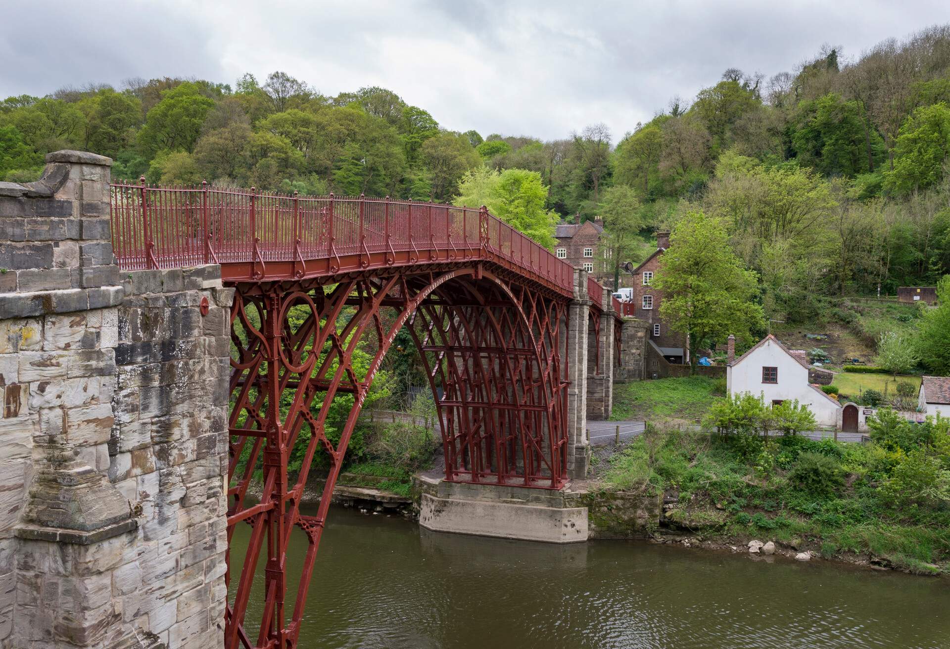 The UNESCO world heritage site of Ironbridge in Shropshire. The famous Iron Bridge is the first of its kind in the world. Built in 1779 it crosses the river Severn. Restored in recent years and painted a shade of deep red.