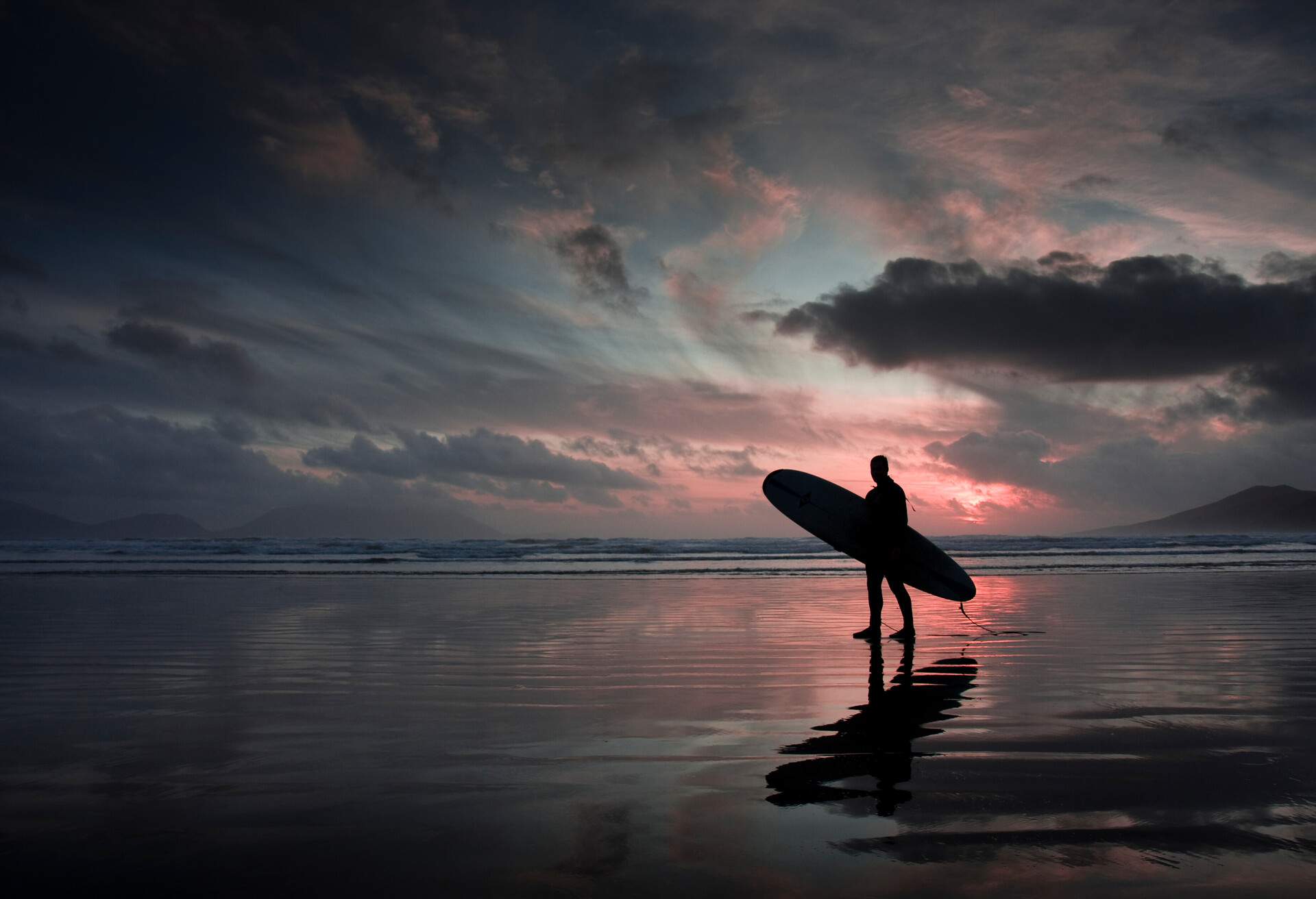 DEST_IRELAND_KERRY_BEACH_THEME_PEOPLE_MA_SURFER_SUNSET_GettyImages-98176941