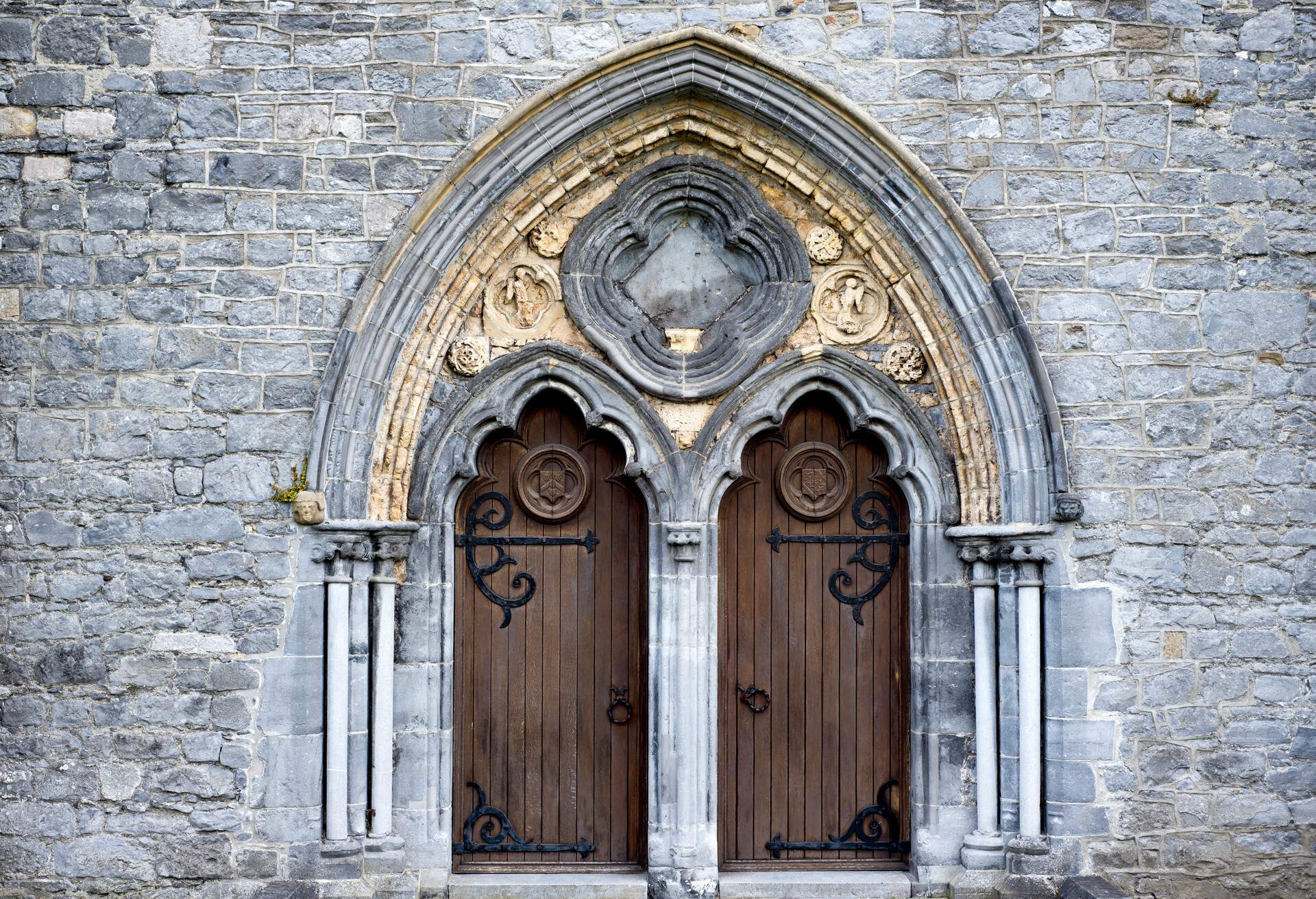 double arched wooden doors in to  St Caniceâ€™s Cathedral kilkenny ireland