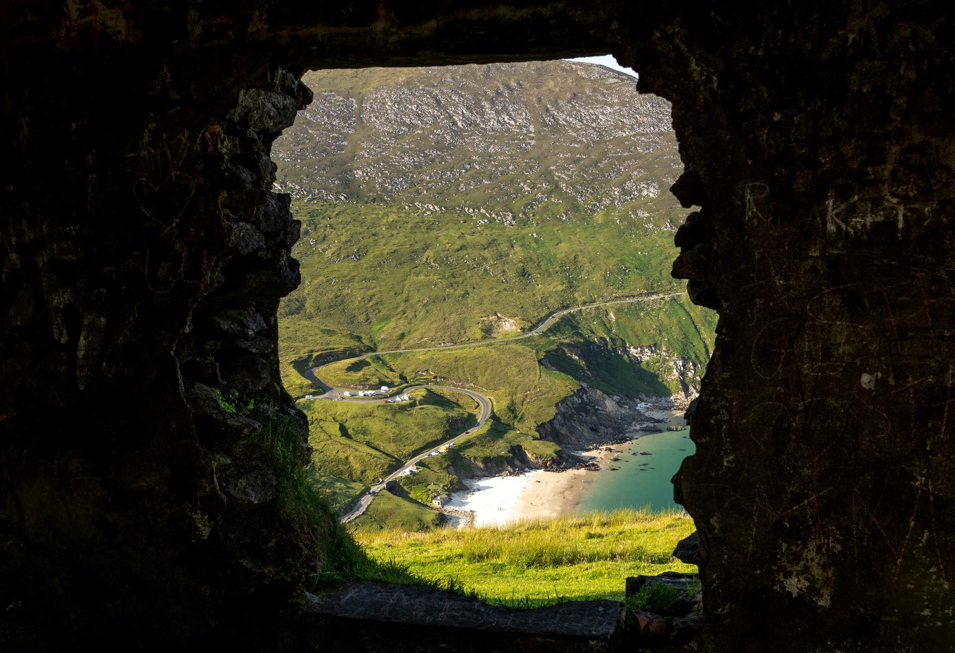 View on Keem beach from a window of an old building. Achill island in Achill, County Mayo, Ireland