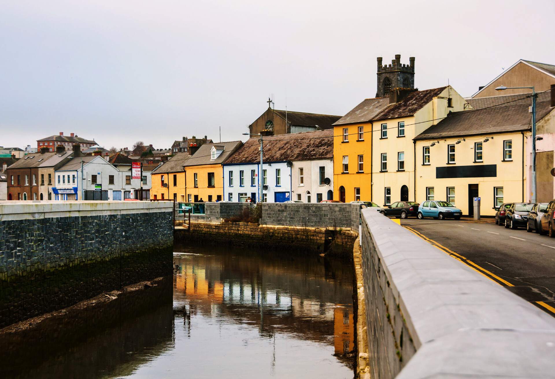 Waterford, Ireland. Cityscape during the day in Waterford, Ireland. It is the oldest city in the country where located many restaurants, shops, bars. Cloudy sky; Shutterstock ID 659600335