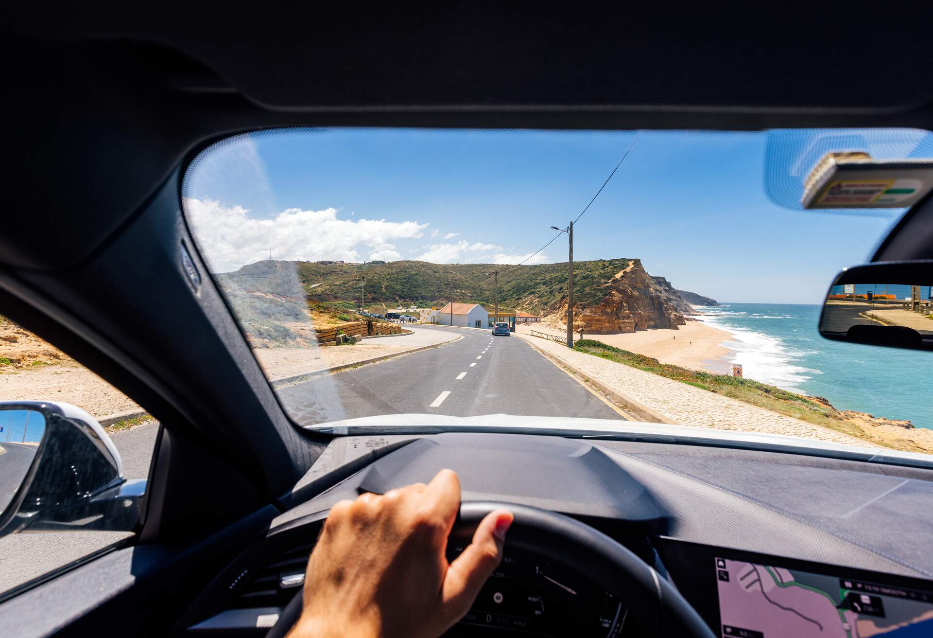 DEST_PORTUGAL_THEME_BEACH_CAR_GettyImages-1397617471