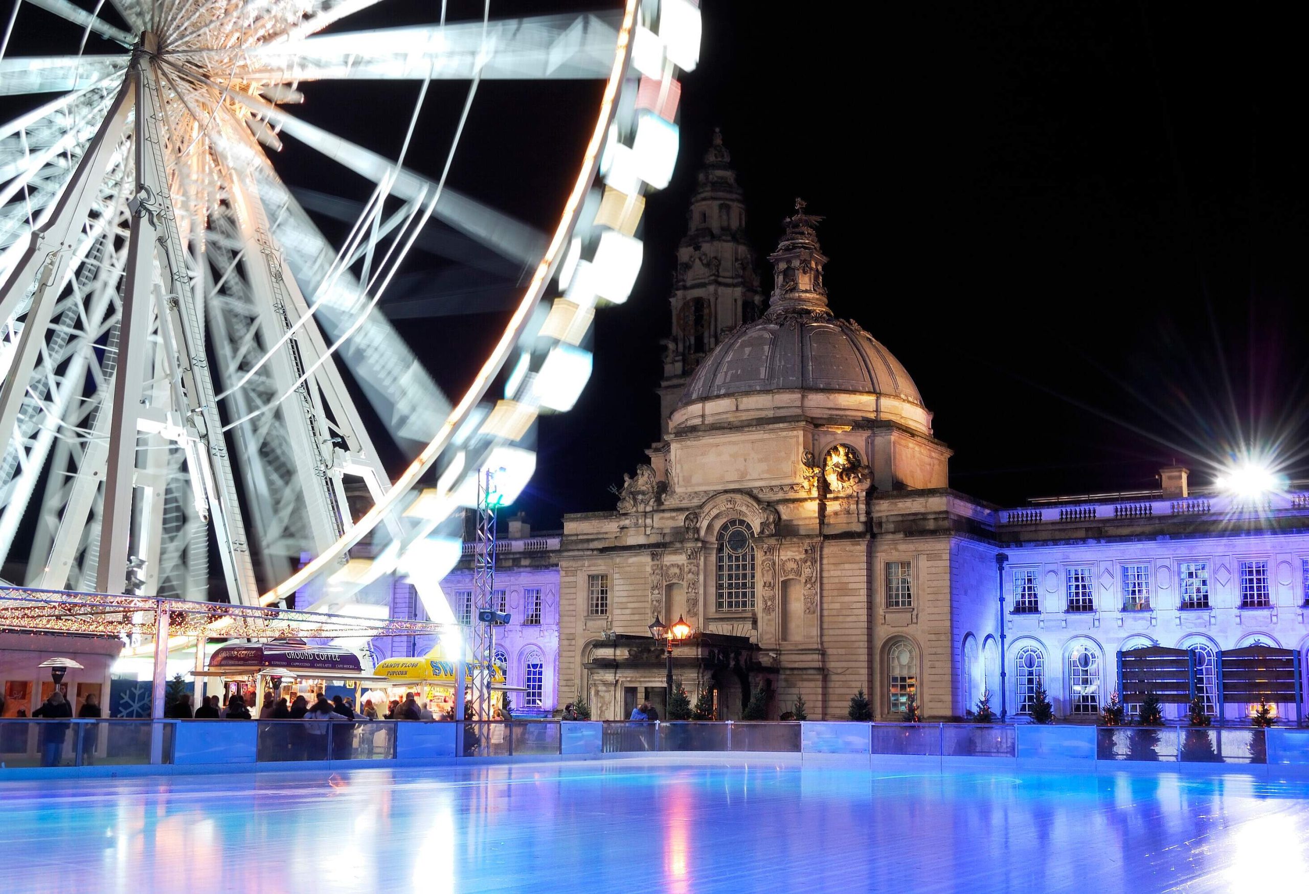 An empty Ice rink and winterwonderland Cardiff. City Hall in background.