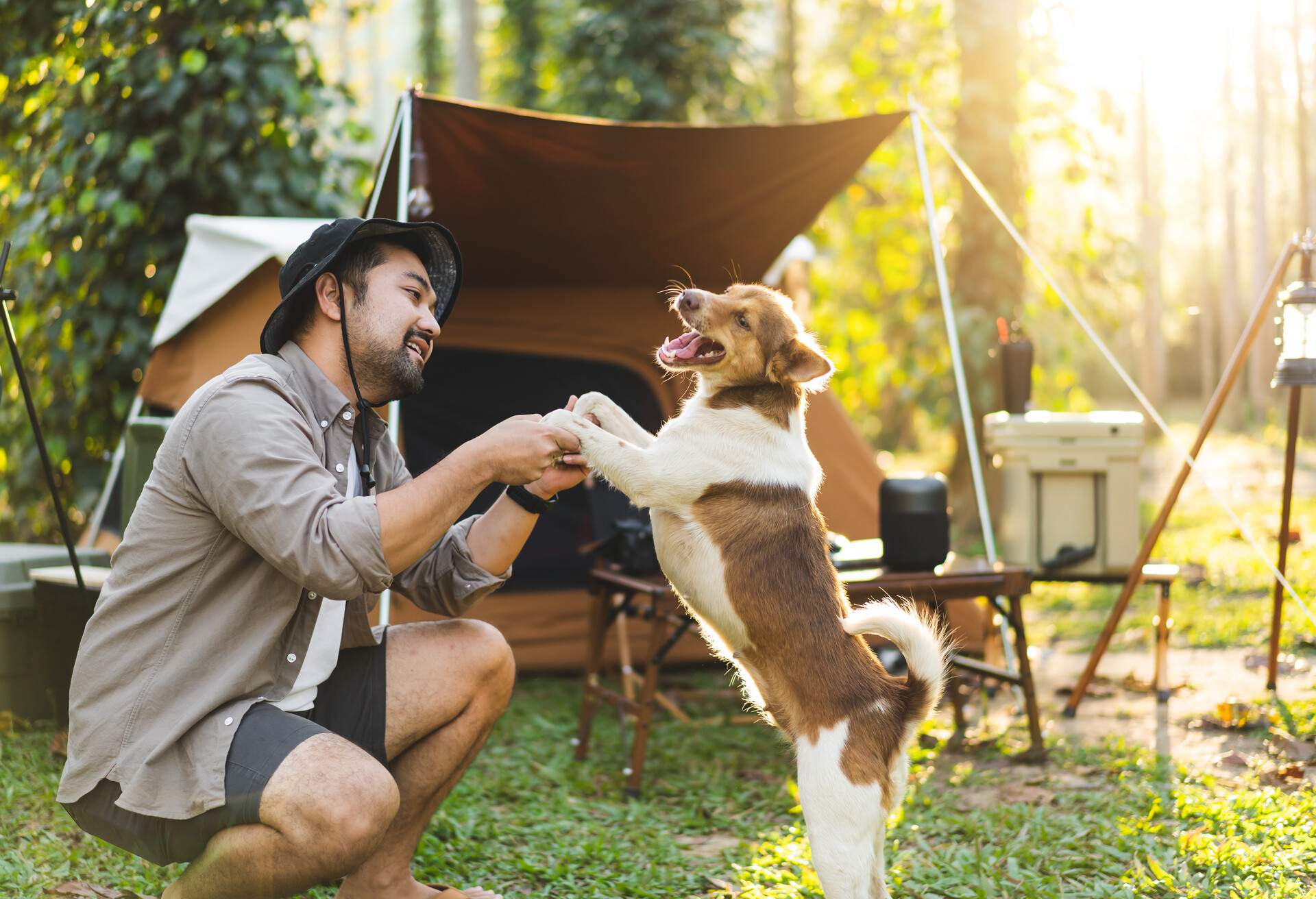 THEME_CAMPING_PEOPLE_MAN_DOG_GettyImages-1366211195