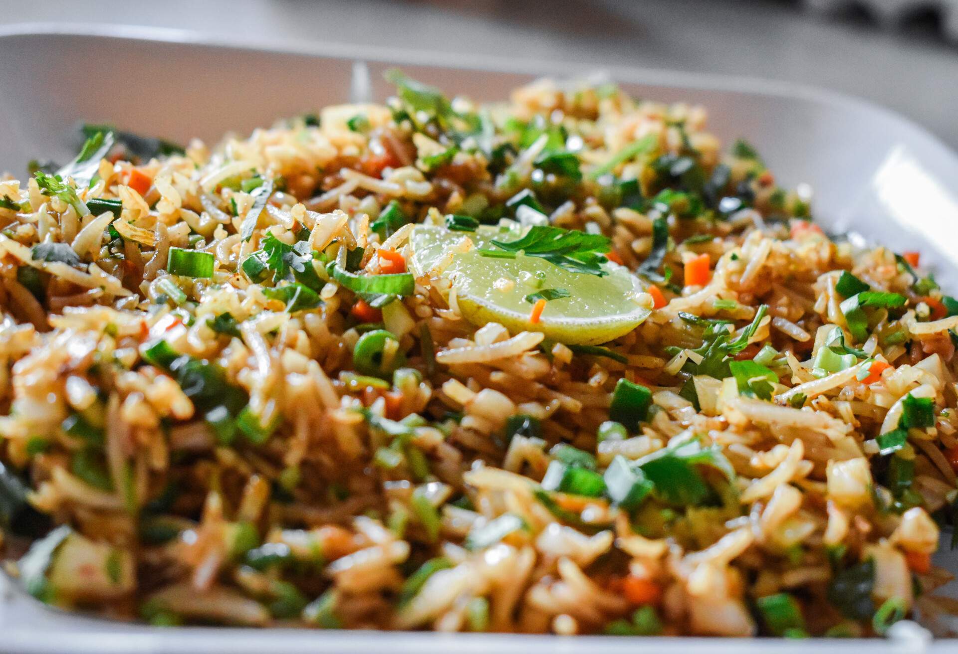 Close up shot of fried rice in plate at restaurant.