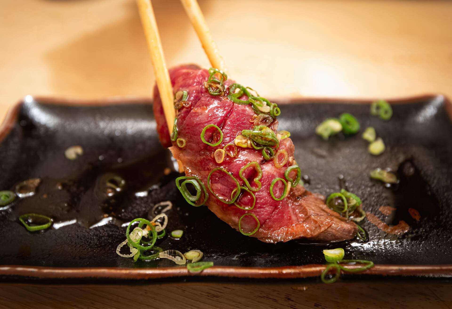 Wagyu (premium marbled meat)sushi was picked up for a plate. This picture was taken at Umeda, Osaka, Japan