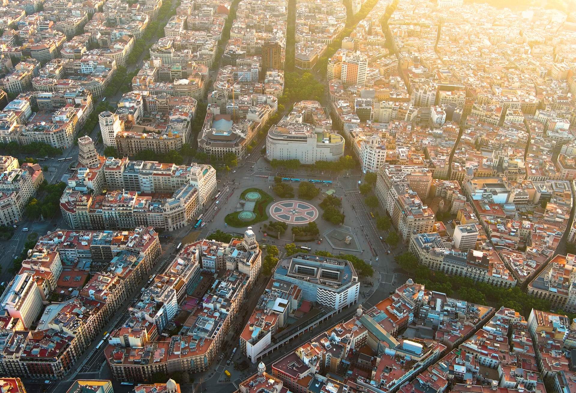 Plaça de Catalunya is a large square in central Barcelona that is generally considered to be both its city centre and the place where the old city (Barri Gòtic and Raval, in Ciutat Vella) and the 19th century-built Eixample meet.