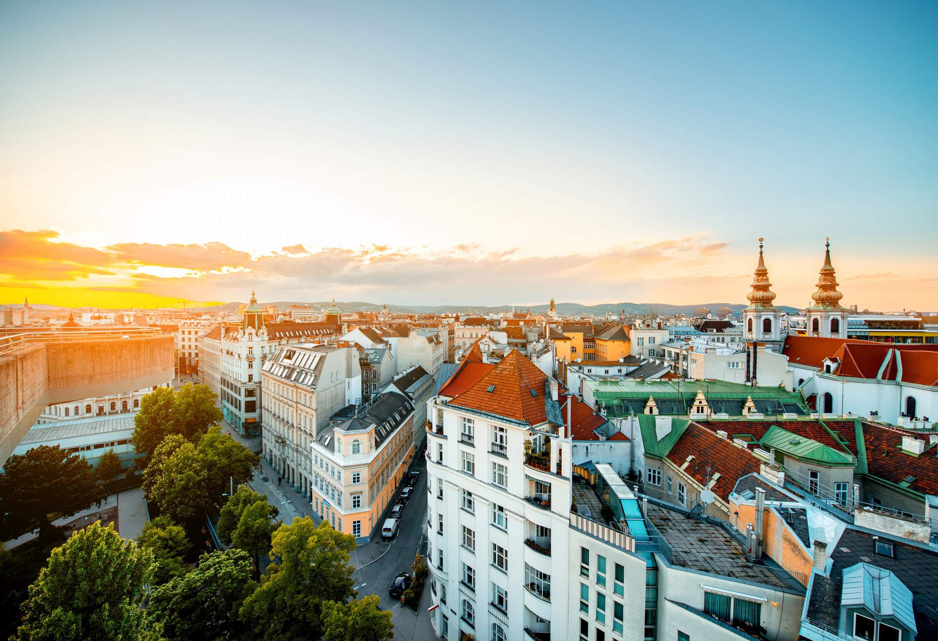 Panoramic cityscape view on Vienna city with Mariahilfer church towers on the sunset in Austria