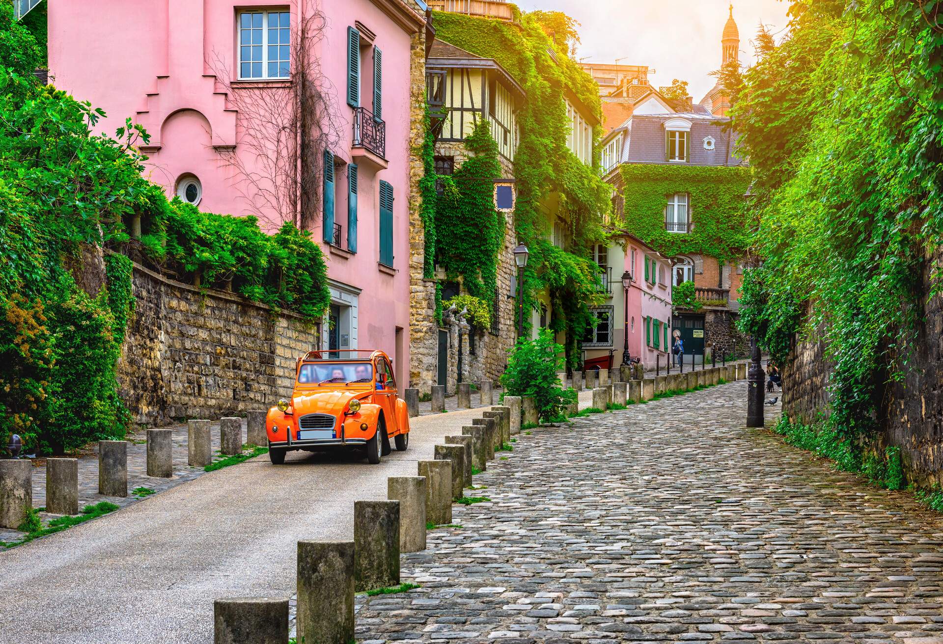 View of old street in quarter Montmartre in Paris, France. Cozy cityscape of Paris. Architecture and landmarks of Paris. ; Shutterstock ID 749469604; Purpose: ; Brand (KAYAK, Momondo, Any):