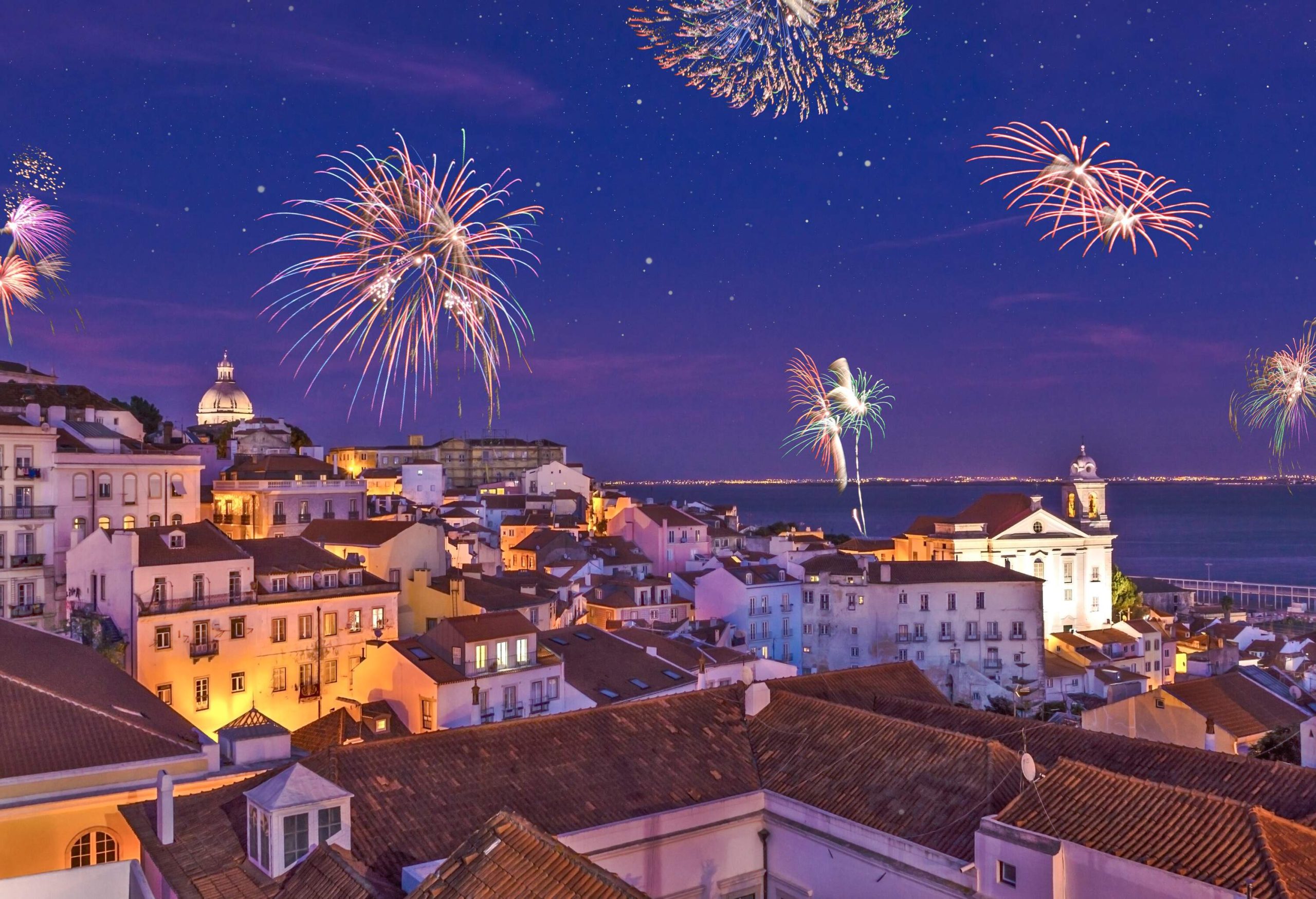 Assembly of fireworks above the district Alfama at new years eve in the portuguese capital.