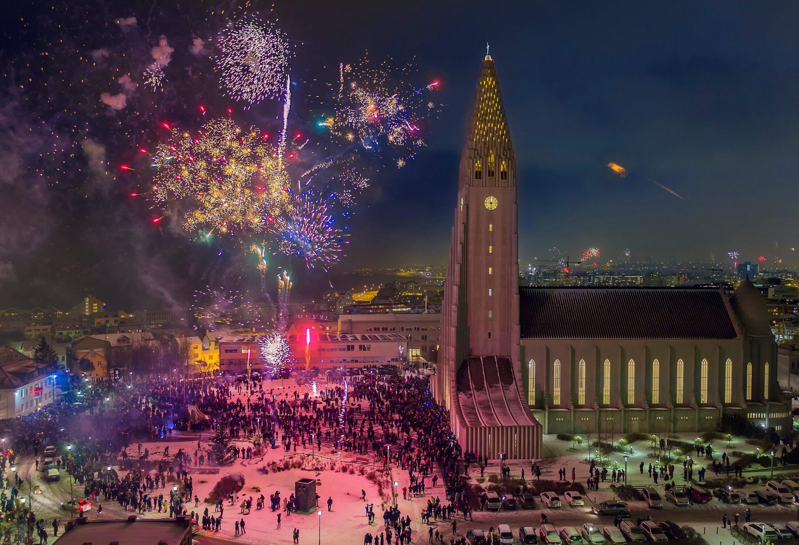 People gathered in the park next to the tallest church in Iceland to witness the colourful fireworks performance display on New Year’s Eve.