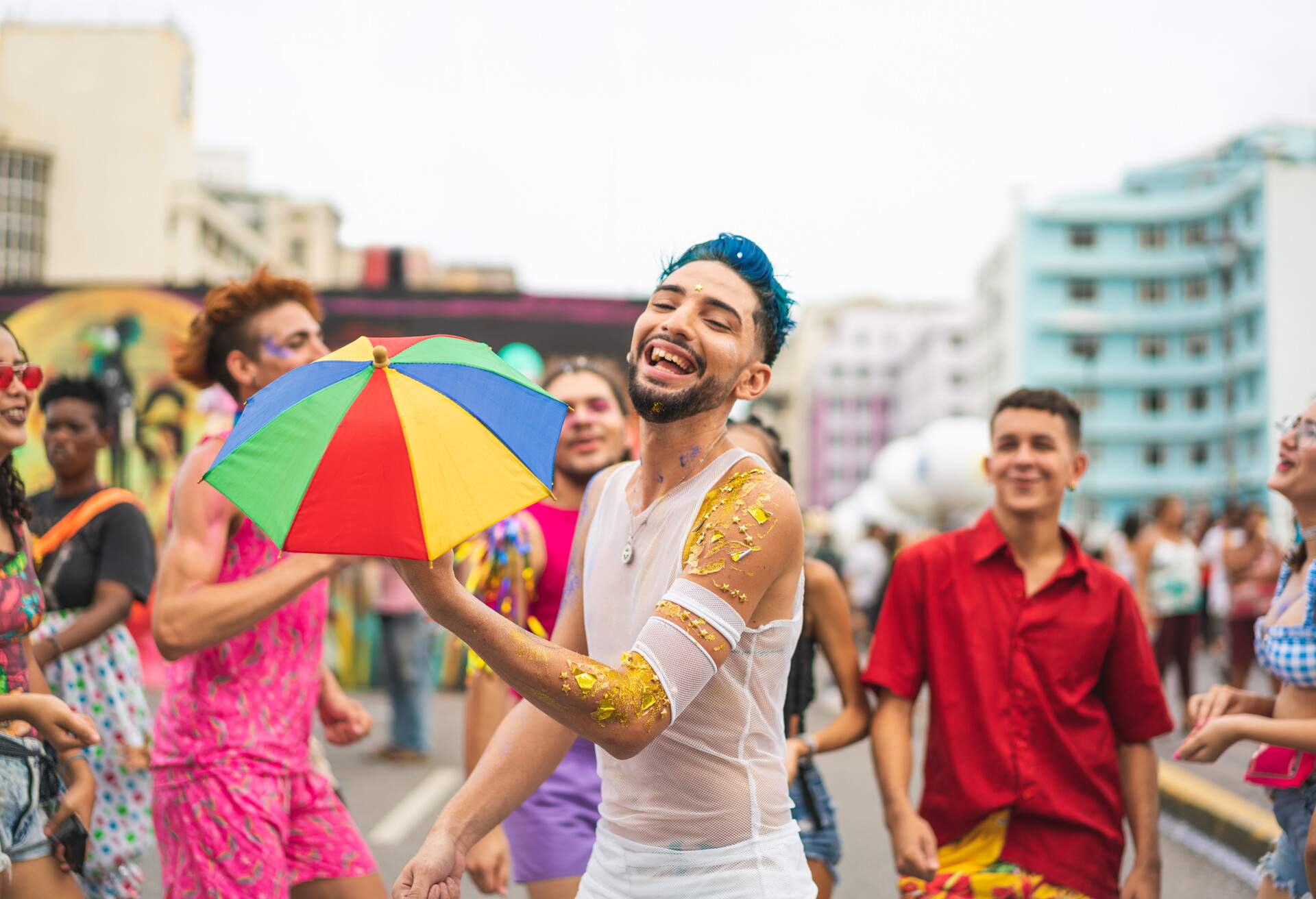 THEME_GAY-PRIDE_STREET_PARTY_FRIENDS_LGBTQ_GettyImages-1361803831