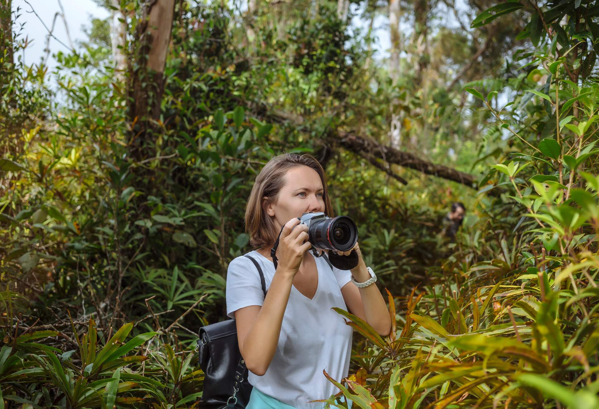 Young woman with camera in Bali. 