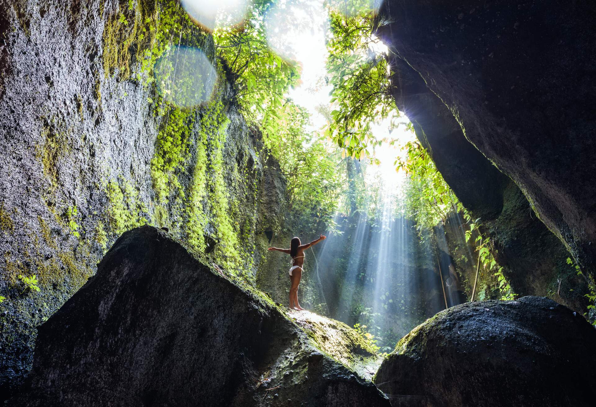 Woman in bikini in the forest of Bali, Indonesia 