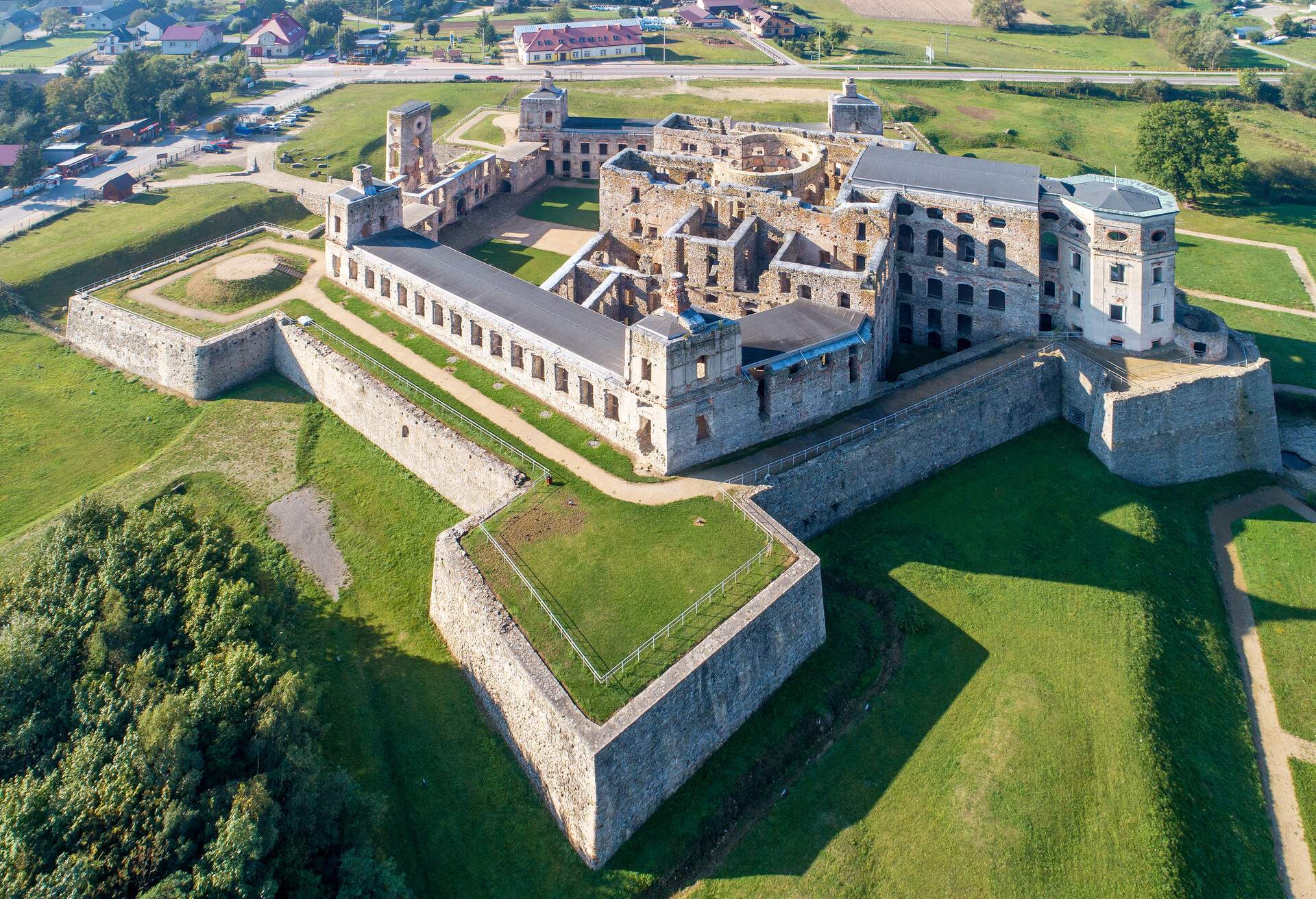 Old, ruined castle Krzyztopor in Ujazd, Poland, built in 17th century, ruined to naked walls in 18th century. Aerial view in the morning; Shutterstock ID 1213566163