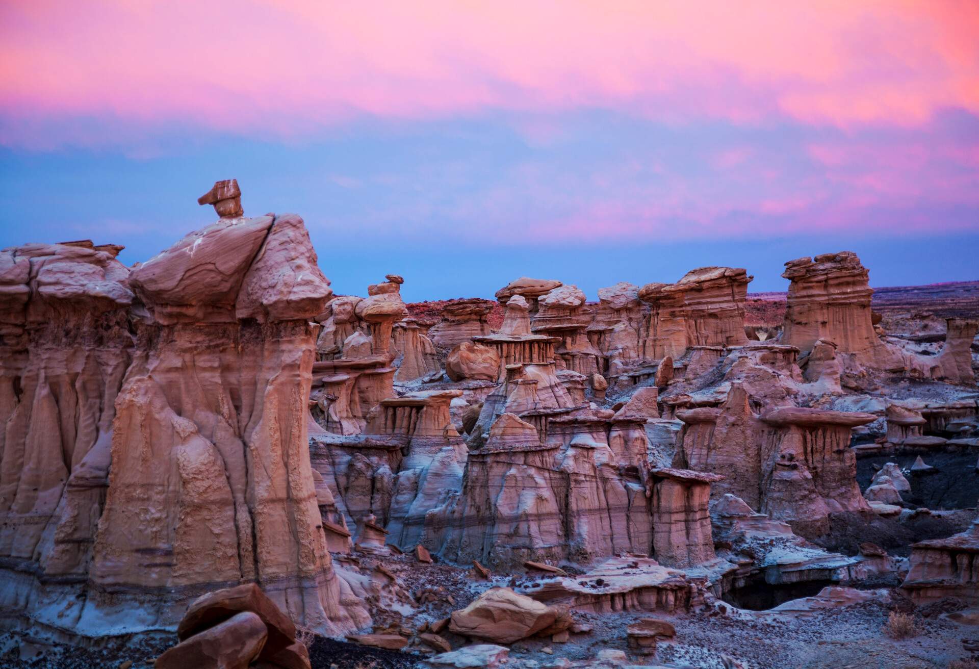 sunset augments the badlands landscape of Ah Shi Sle Pah wilderness in New Mexico