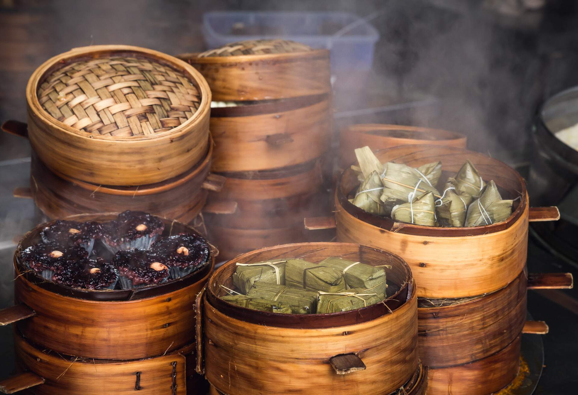 Traditional Chinese steamed food in bamboo steamers in a Market . .